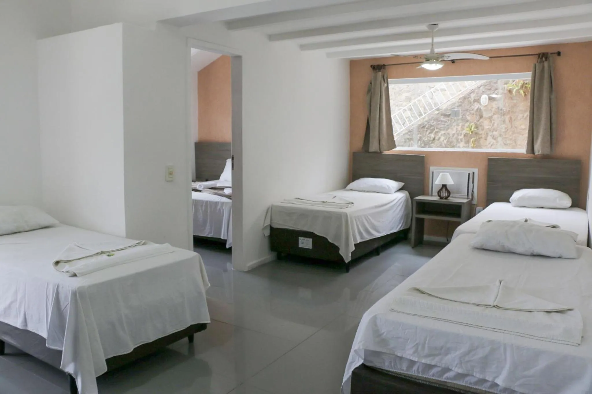 Bed in Tarumã Búzios Hotel