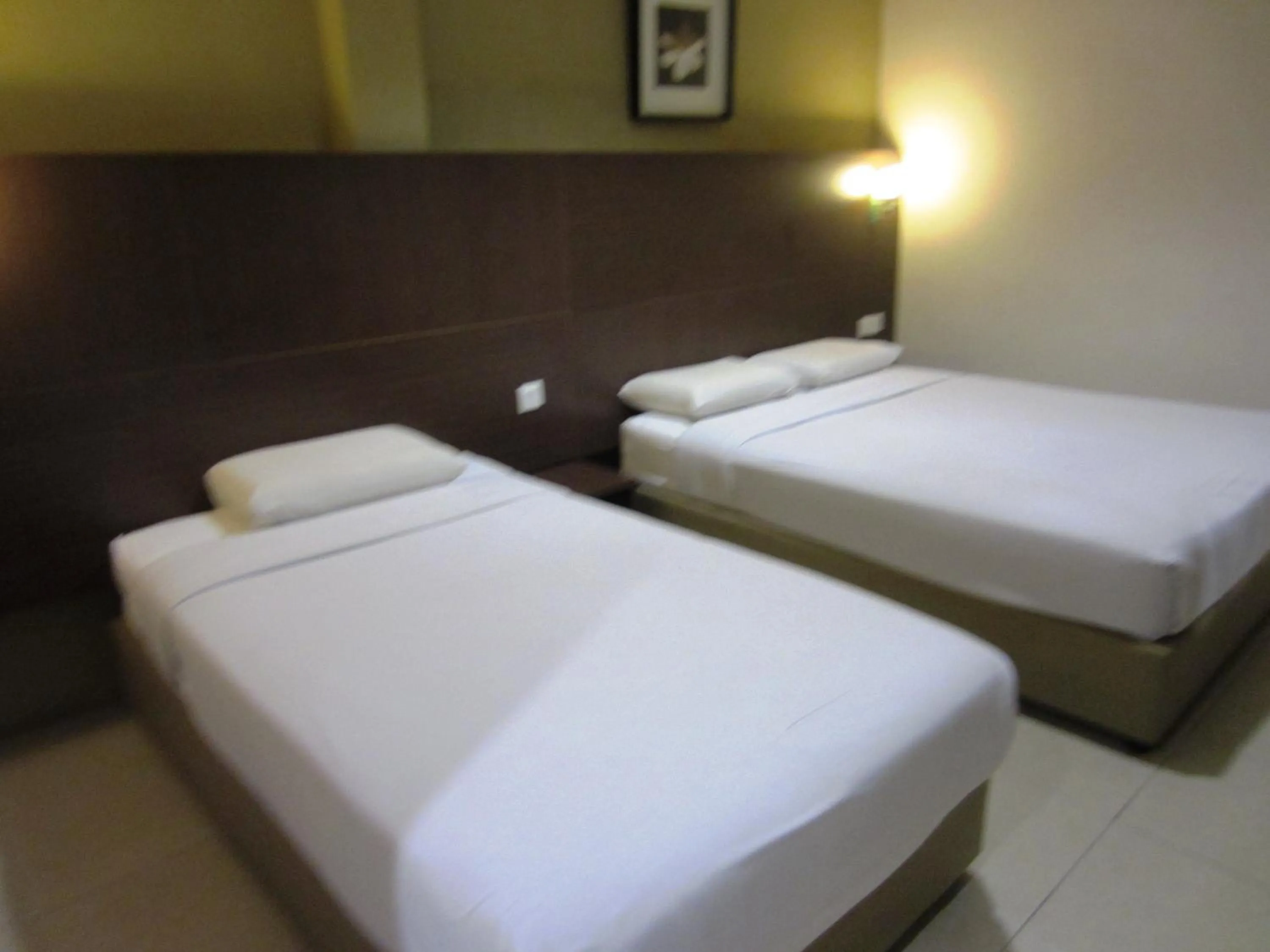 Bed in Radiant Hotel