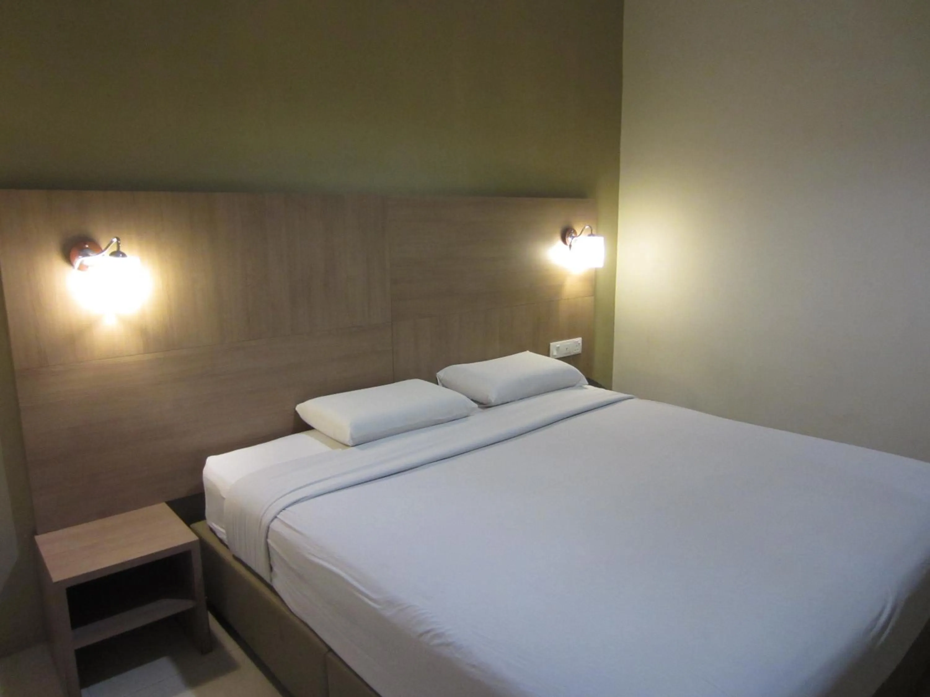 Bed in Radiant Hotel