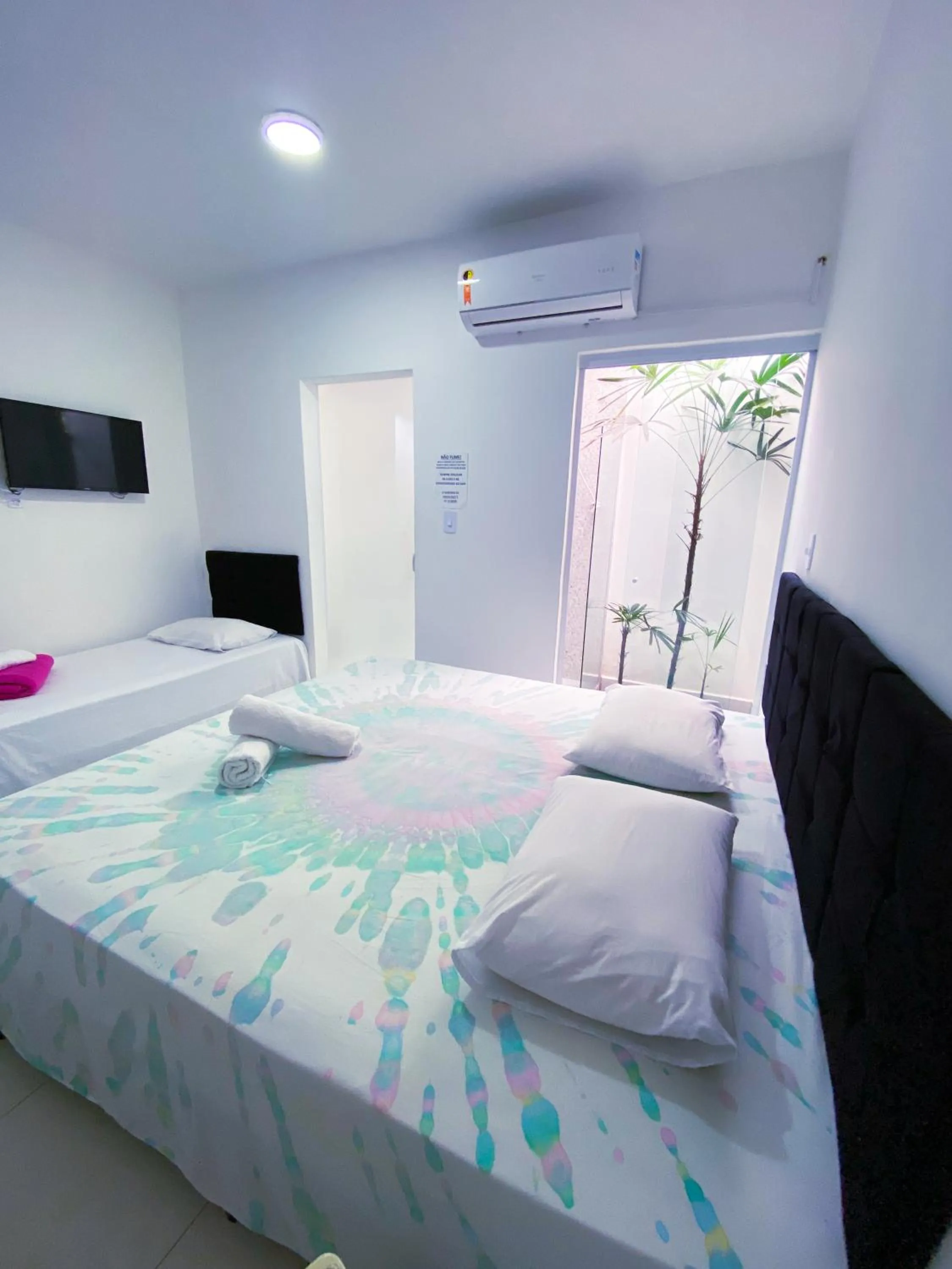 Bed in Pousada Praia do Tombo