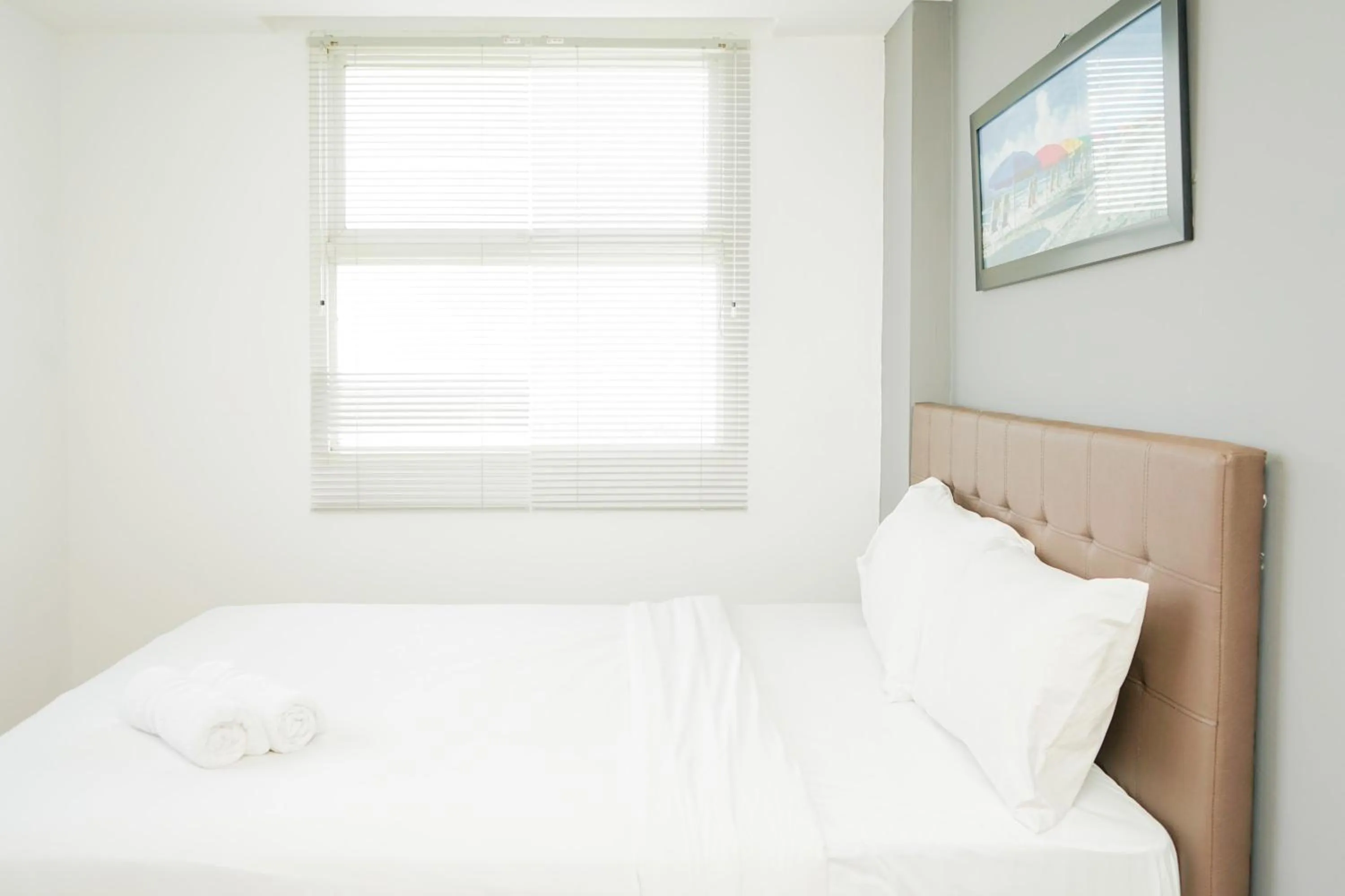 Cozy 2BR Apartment at Tuscany Residences With Garden View By Travelio