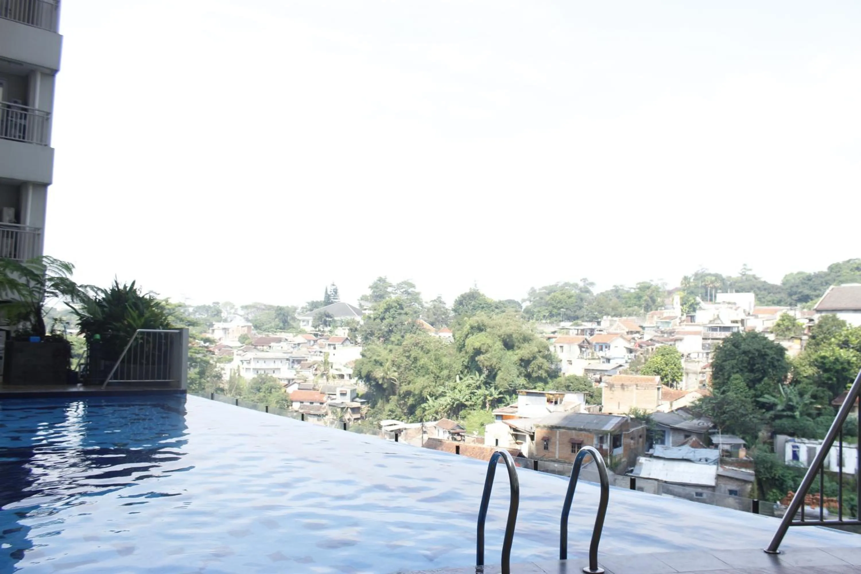 Swimming pool in Spacious 3BR Apartment Parahyangan Residence near UNPAR By Travelio