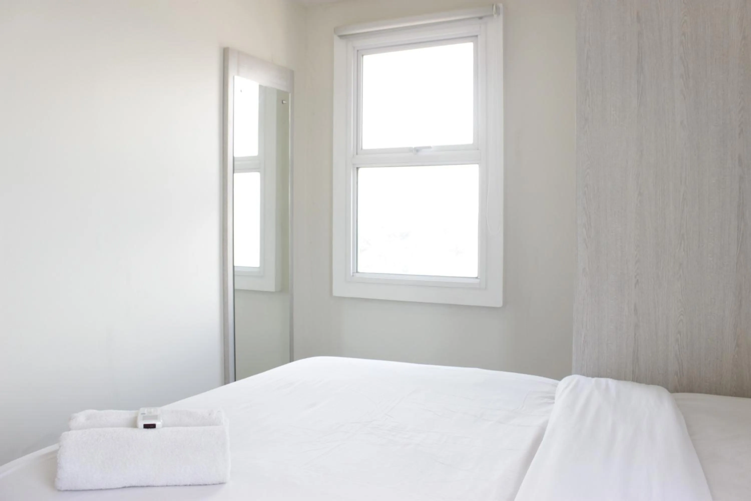 Bed in Spacious 3BR Apartment Parahyangan Residence near UNPAR By Travelio