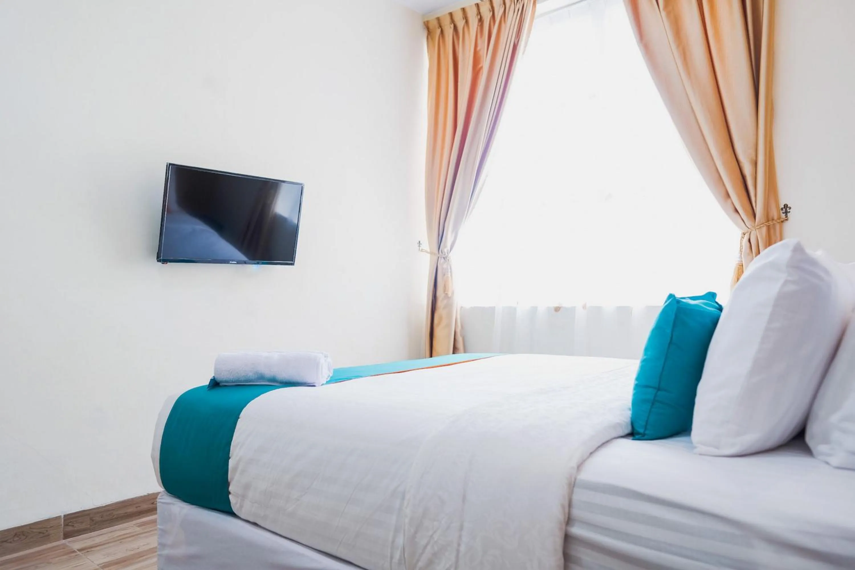 Bedroom, Bed in Sans Hotel Cemara Asri Medan