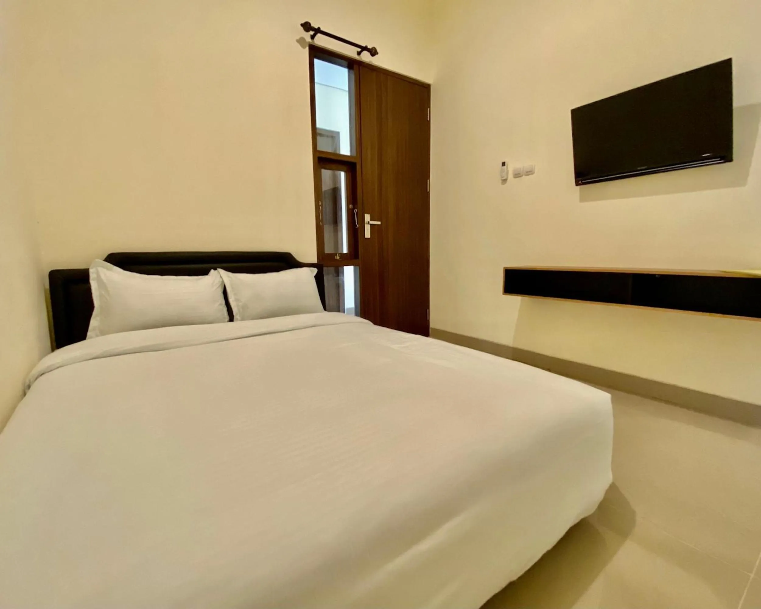 Bed in RedDoorz at Arkana Seturan Pakuwon Mall