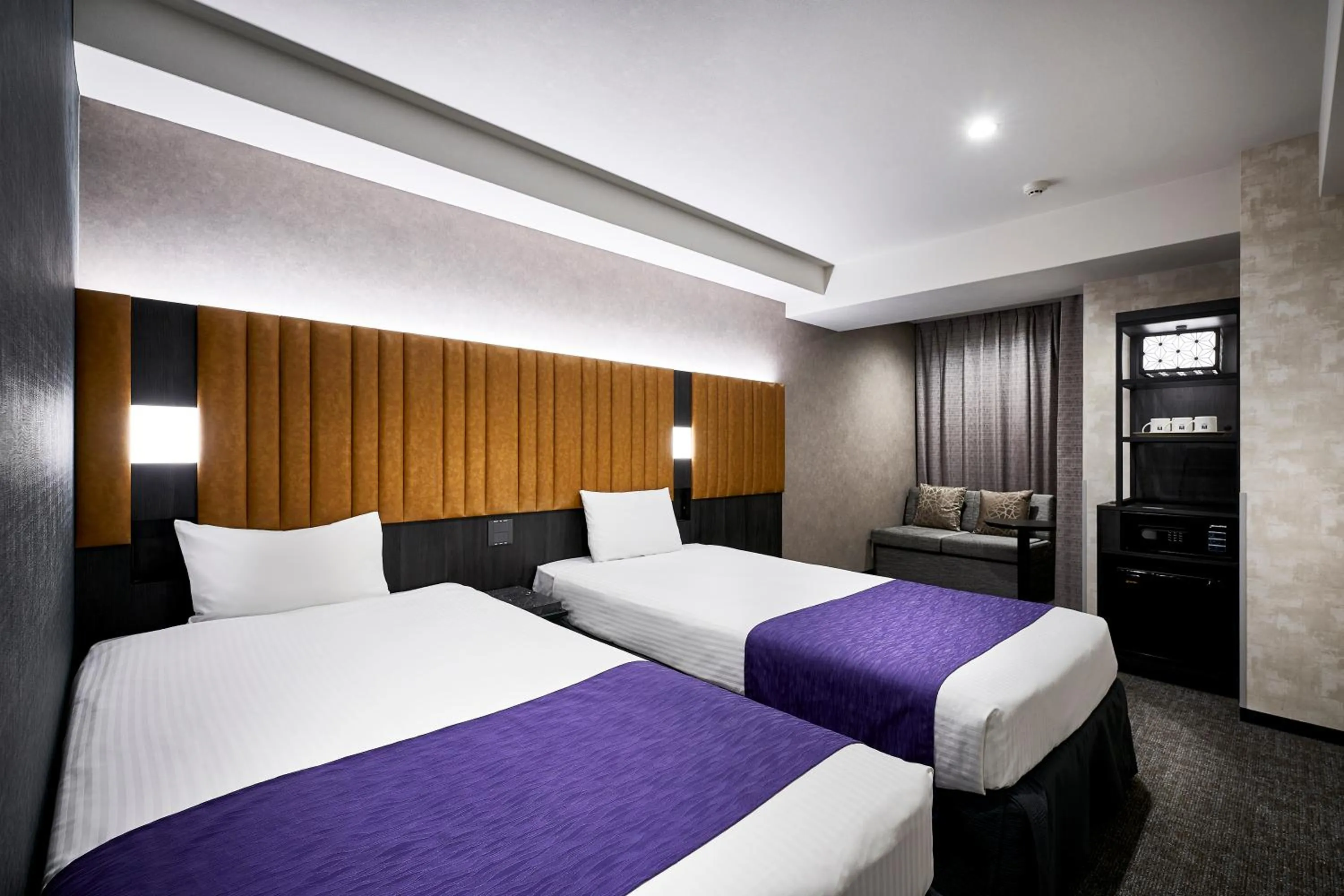 Bed in hotel MONday KYOTO MARUTAMACHI