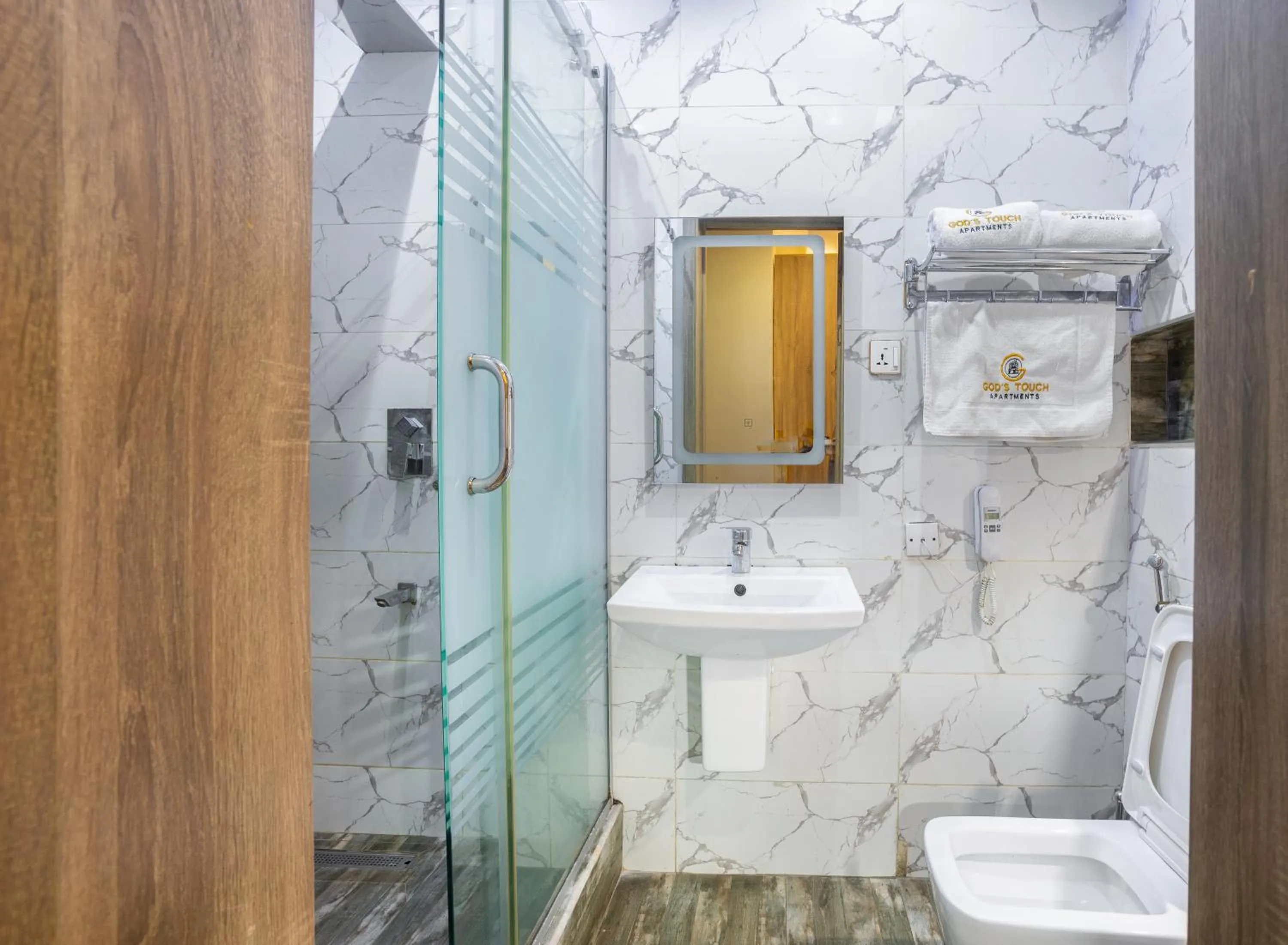 Toilet in God's Touch Apartments Signature