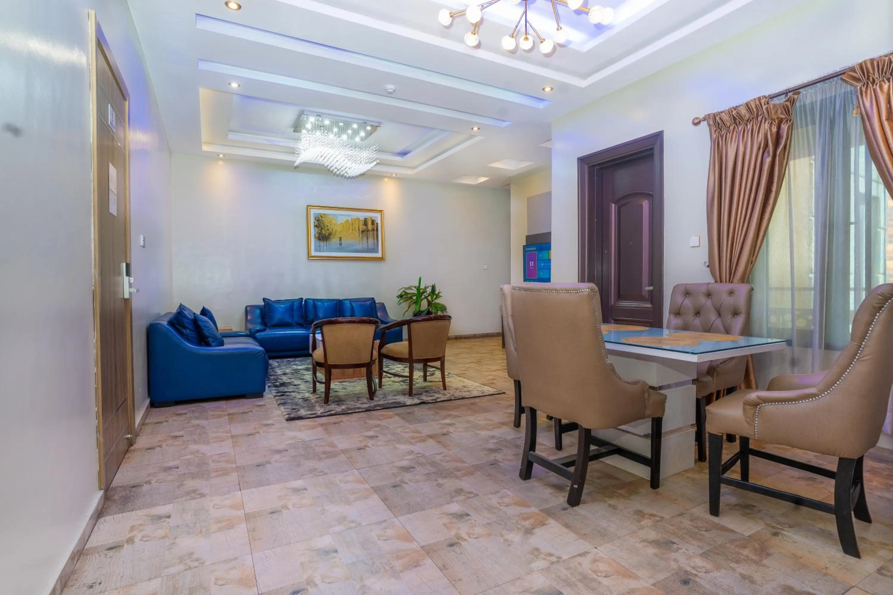 Living room in God's Touch Apartments Signature