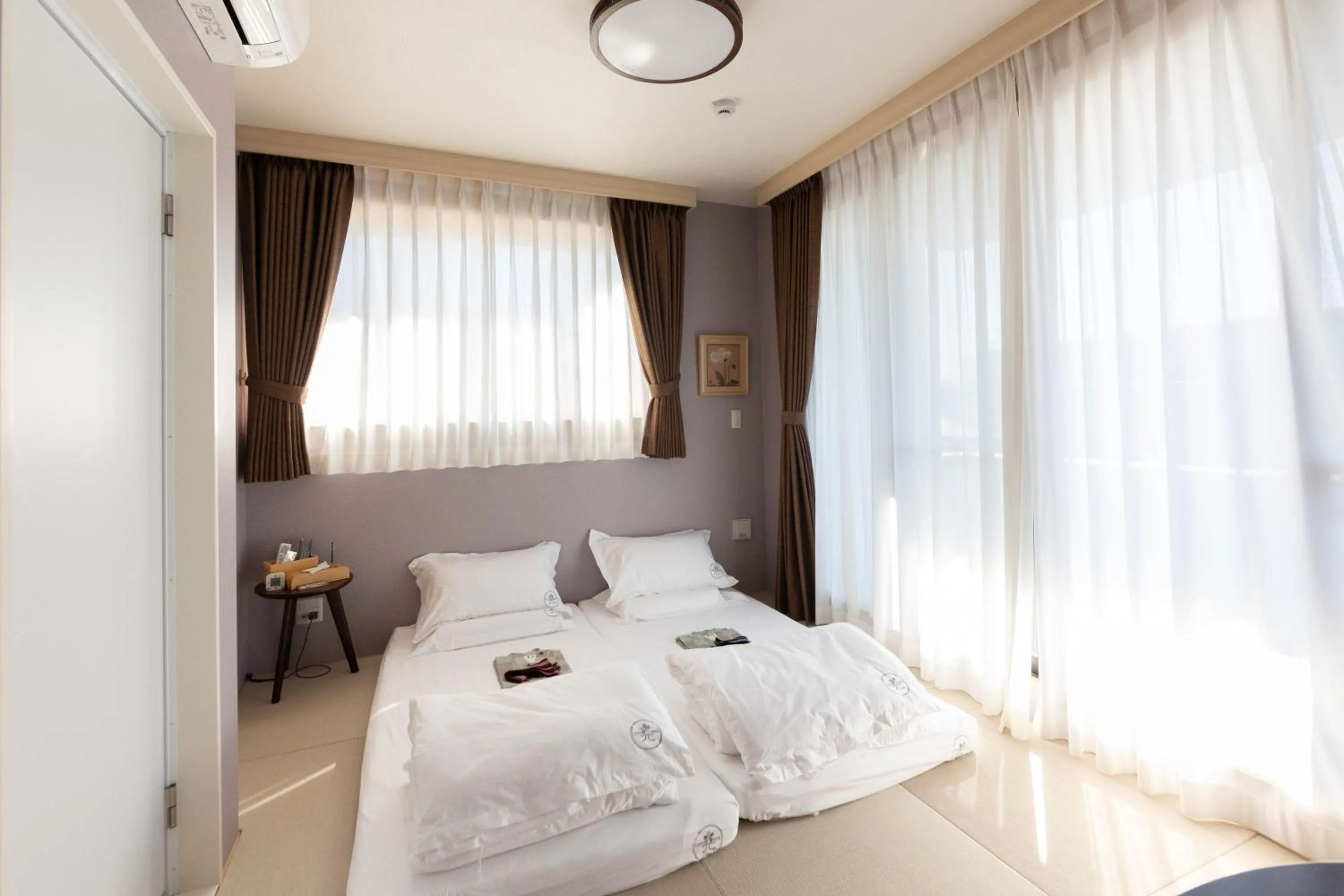 Bed in 灯光旅館 Light hotel