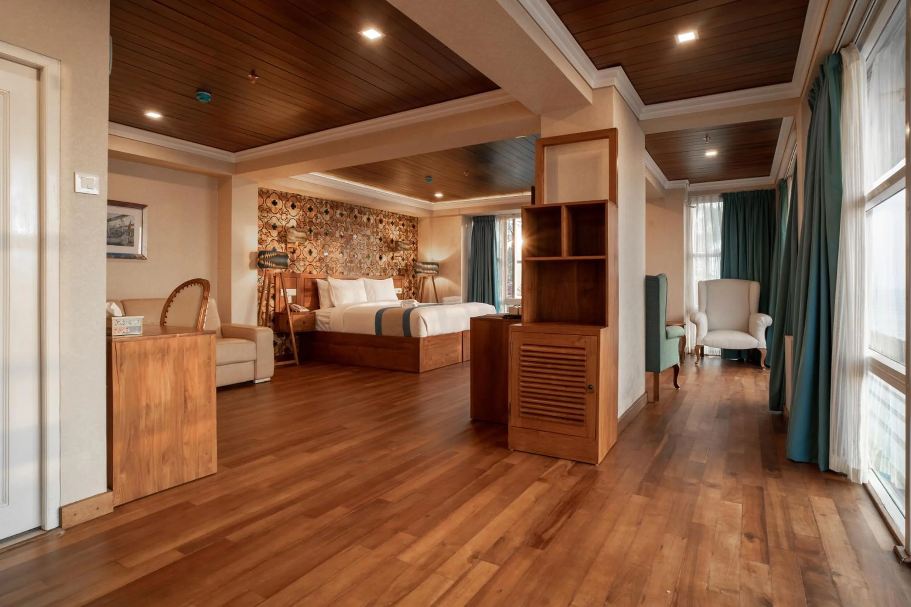 Seating area, Bed in State Beach Resort And Spa