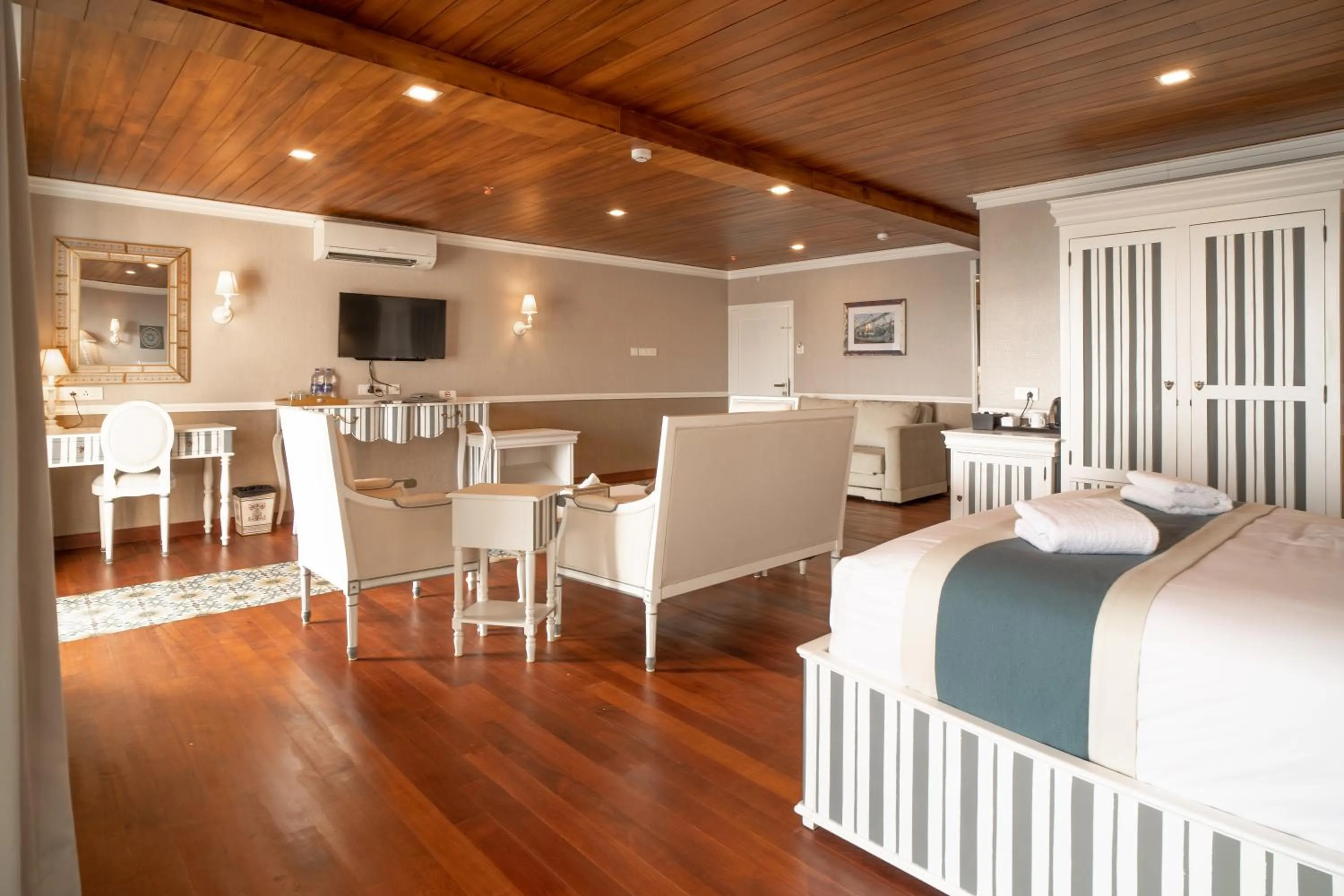 Seating area, Bed in State Beach Resort And Spa