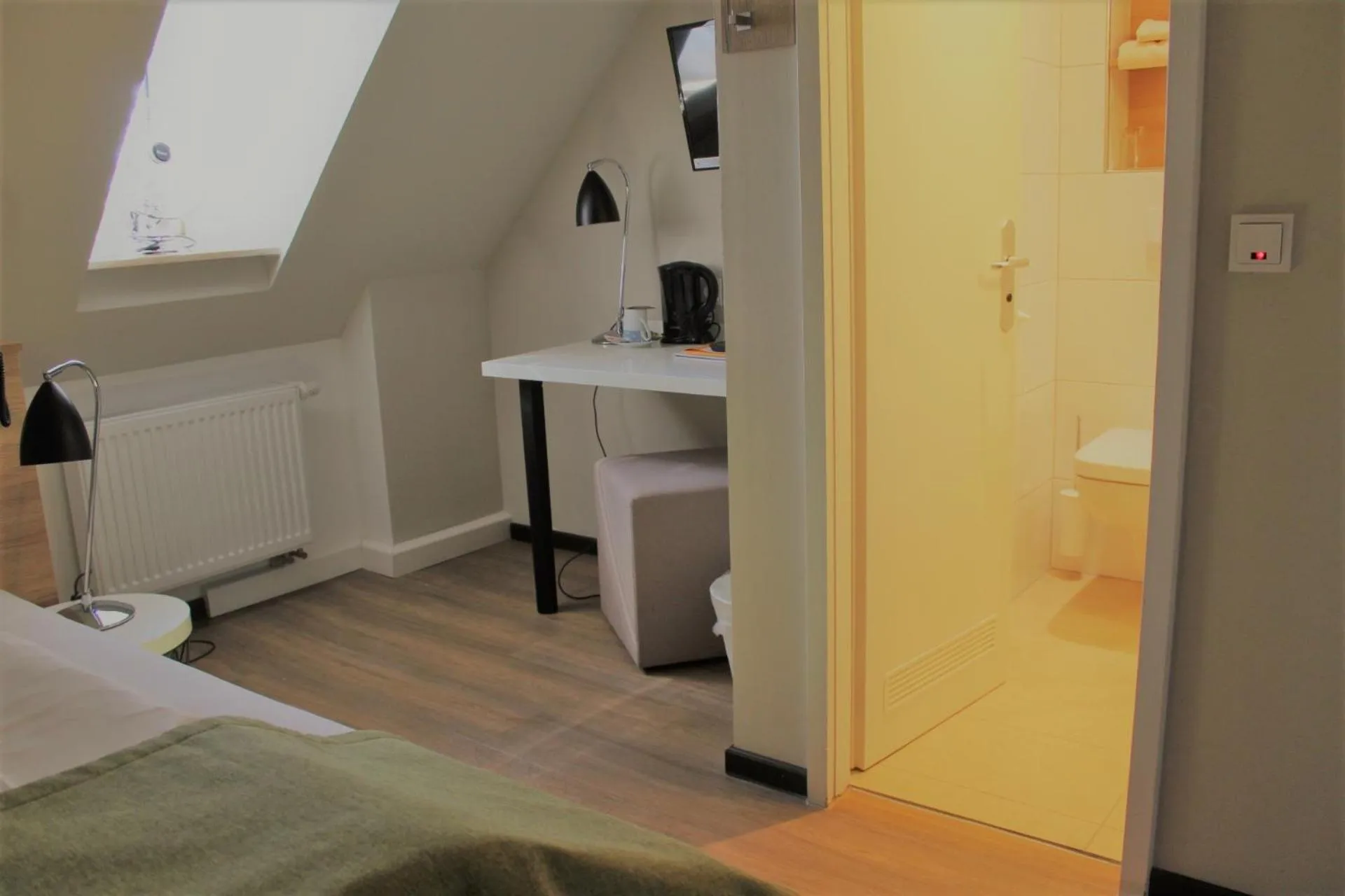 Seating area, Bed in Hotel Eifelbräu