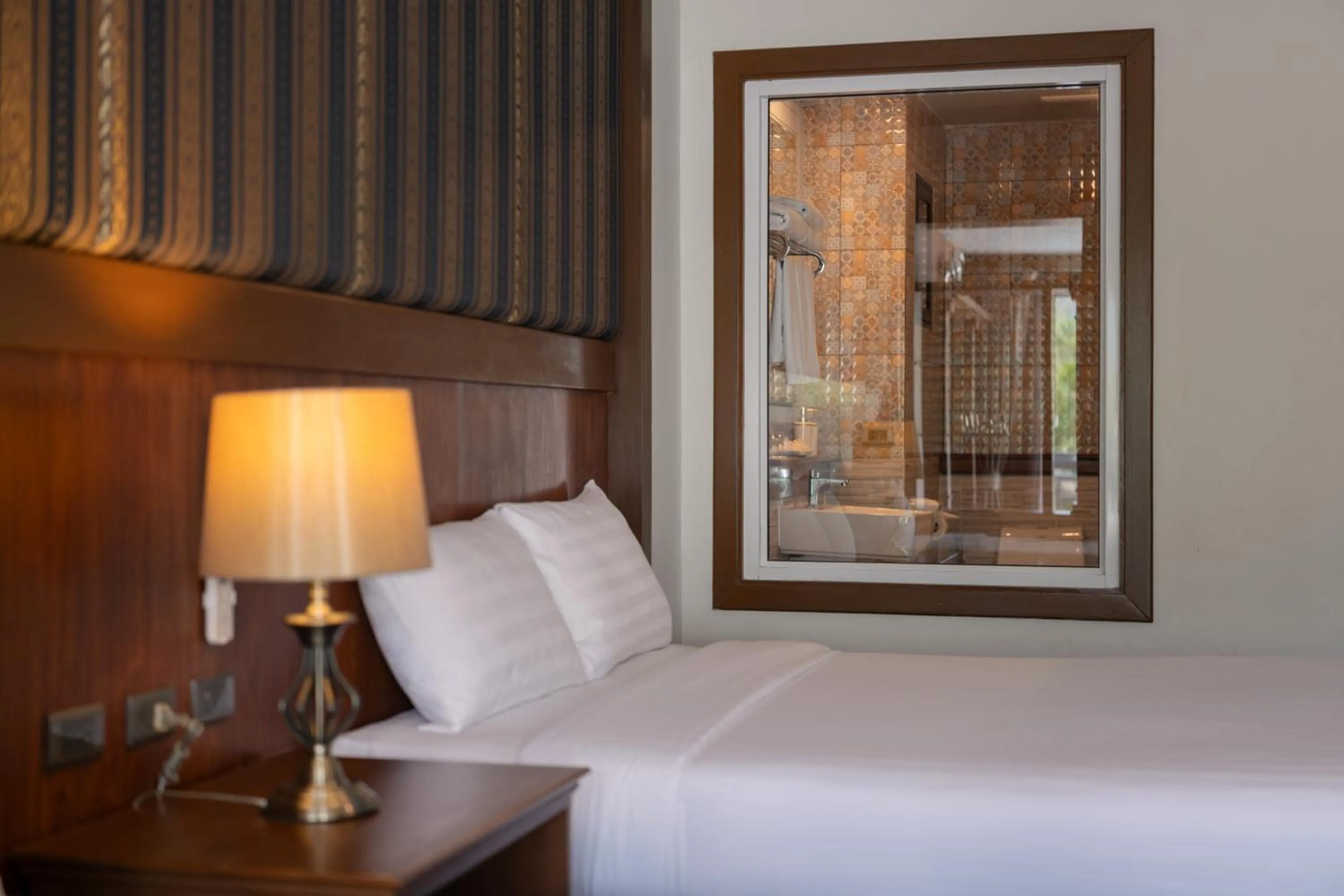 Bed in Le Erawan Phang Nga Hotel