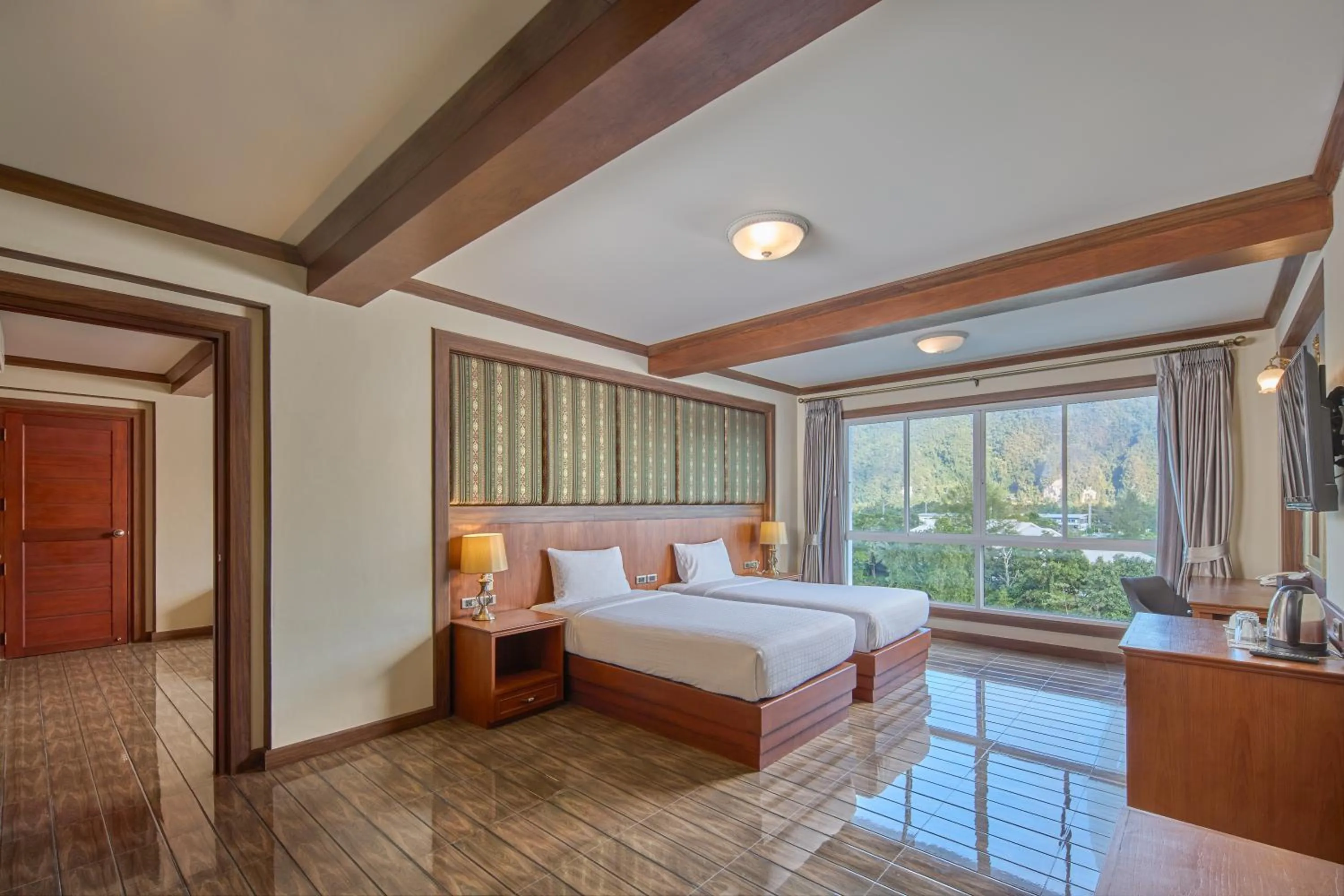 Bed in Le Erawan Phang Nga Hotel