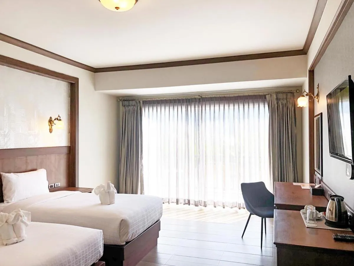 Bed in Le Erawan Phang Nga Hotel