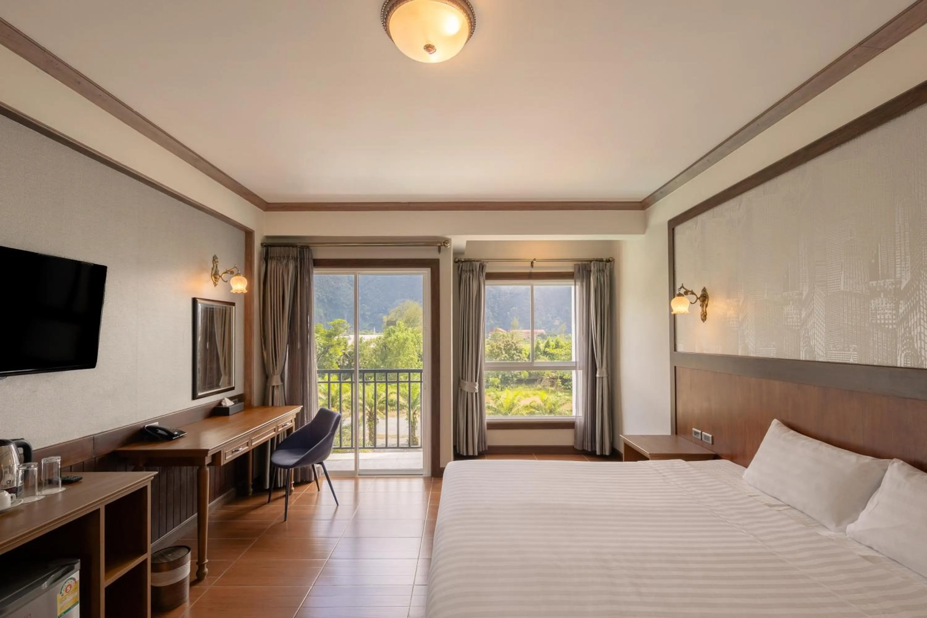 Bed in Le Erawan Phang Nga Hotel