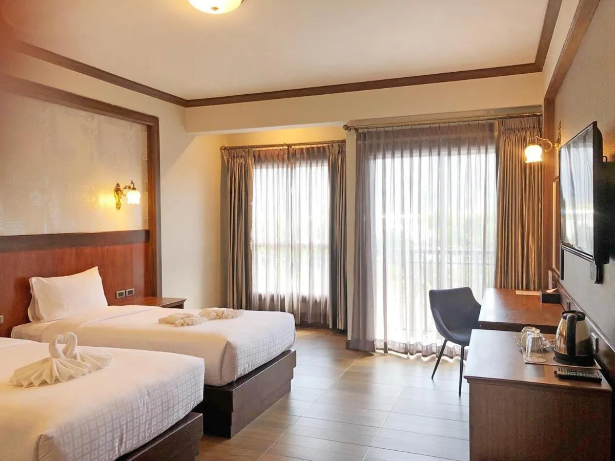 Bed in Le Erawan Phang Nga Hotel