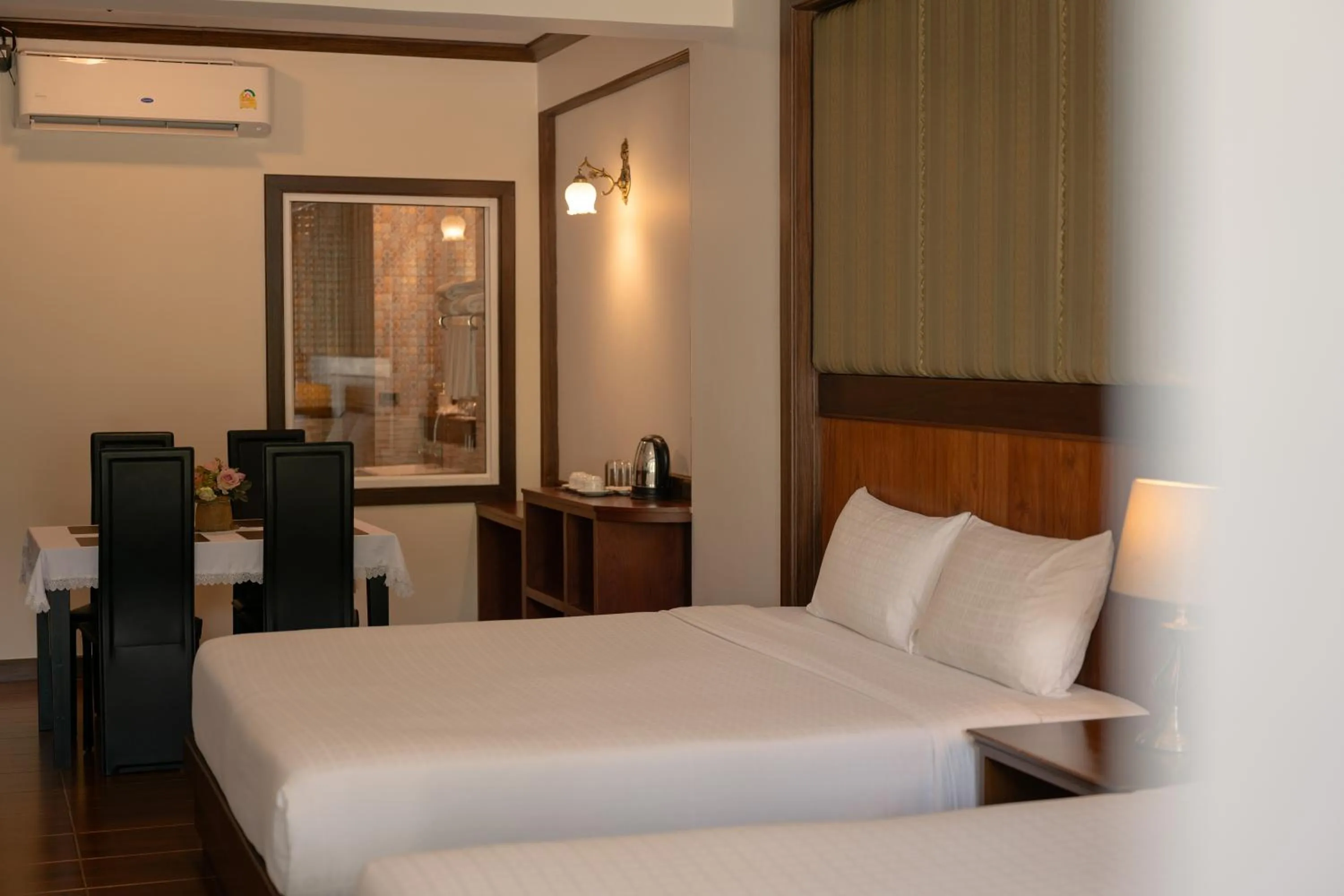 Bed in Le Erawan Phang Nga Hotel