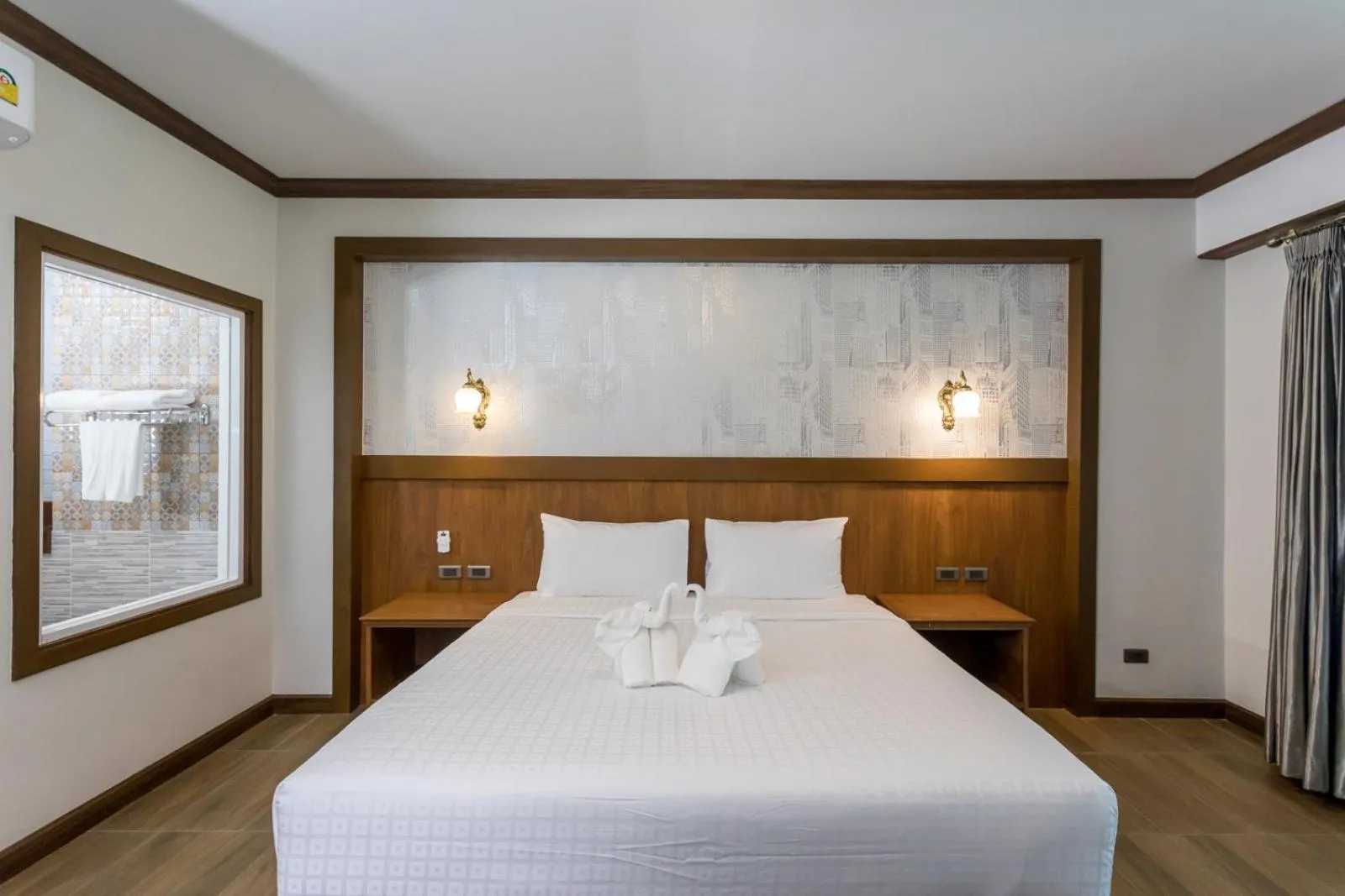 Bed in Le Erawan Phang Nga Hotel