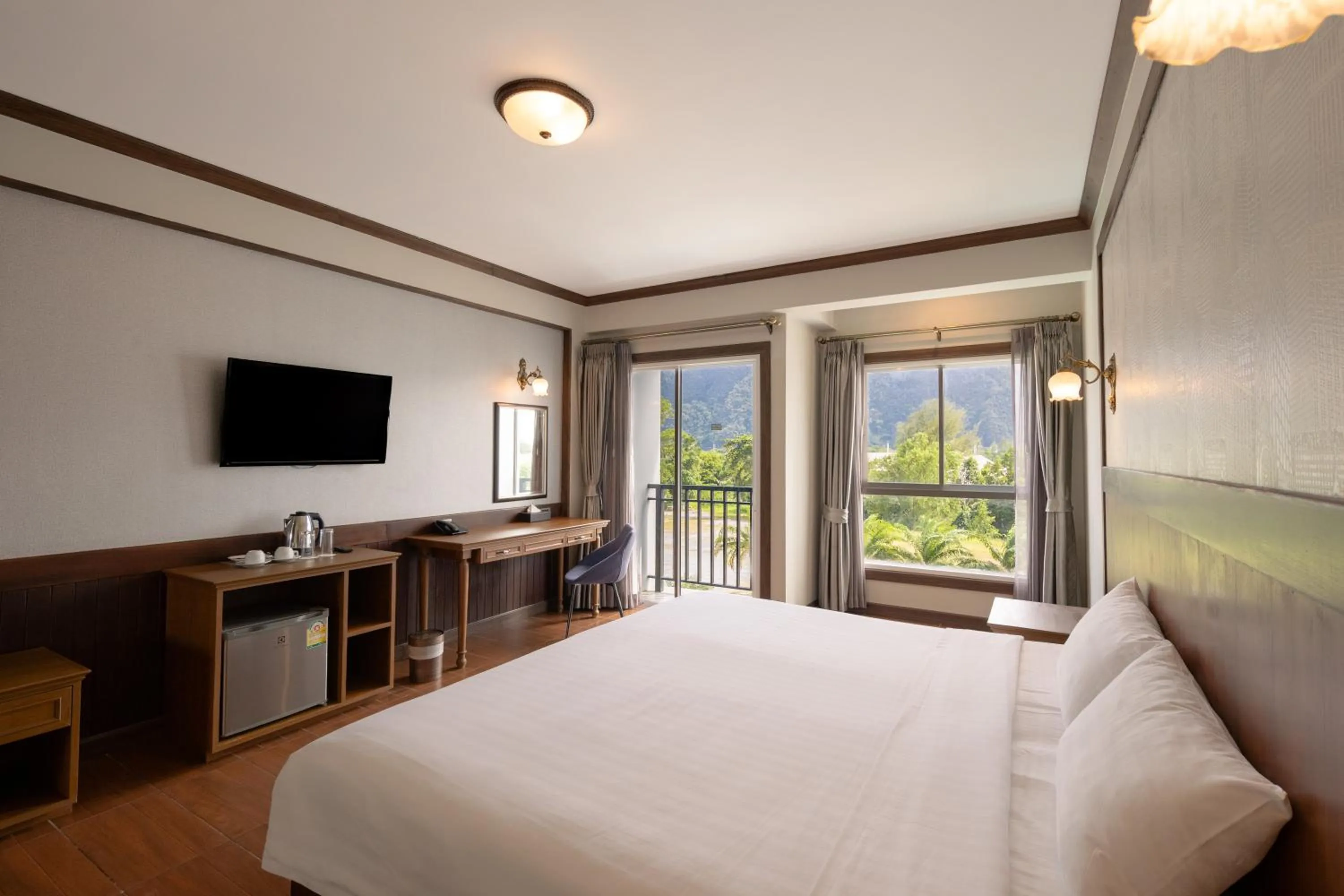 Bed in Le Erawan Phang Nga Hotel