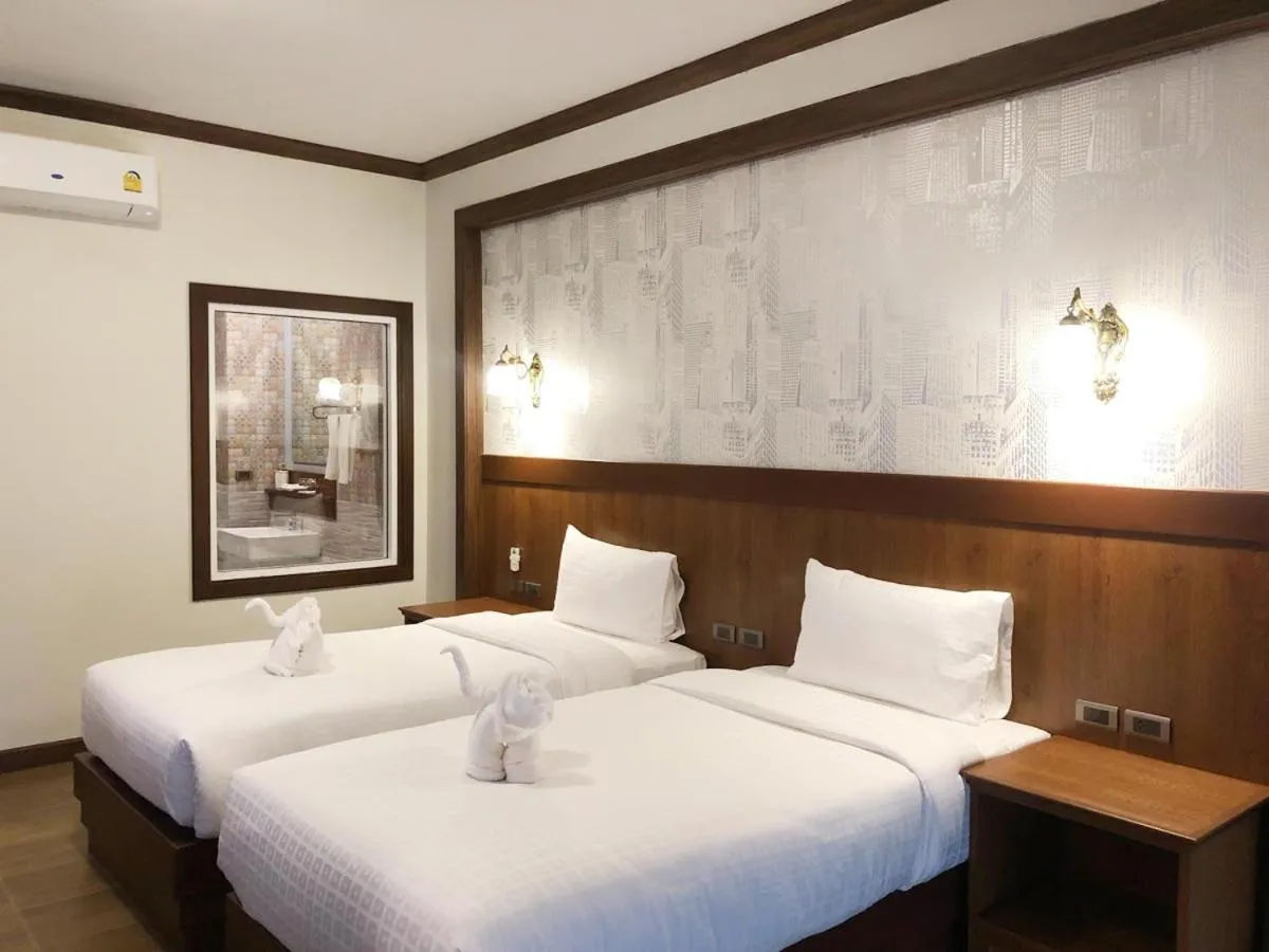 Bed in Le Erawan Phang Nga Hotel