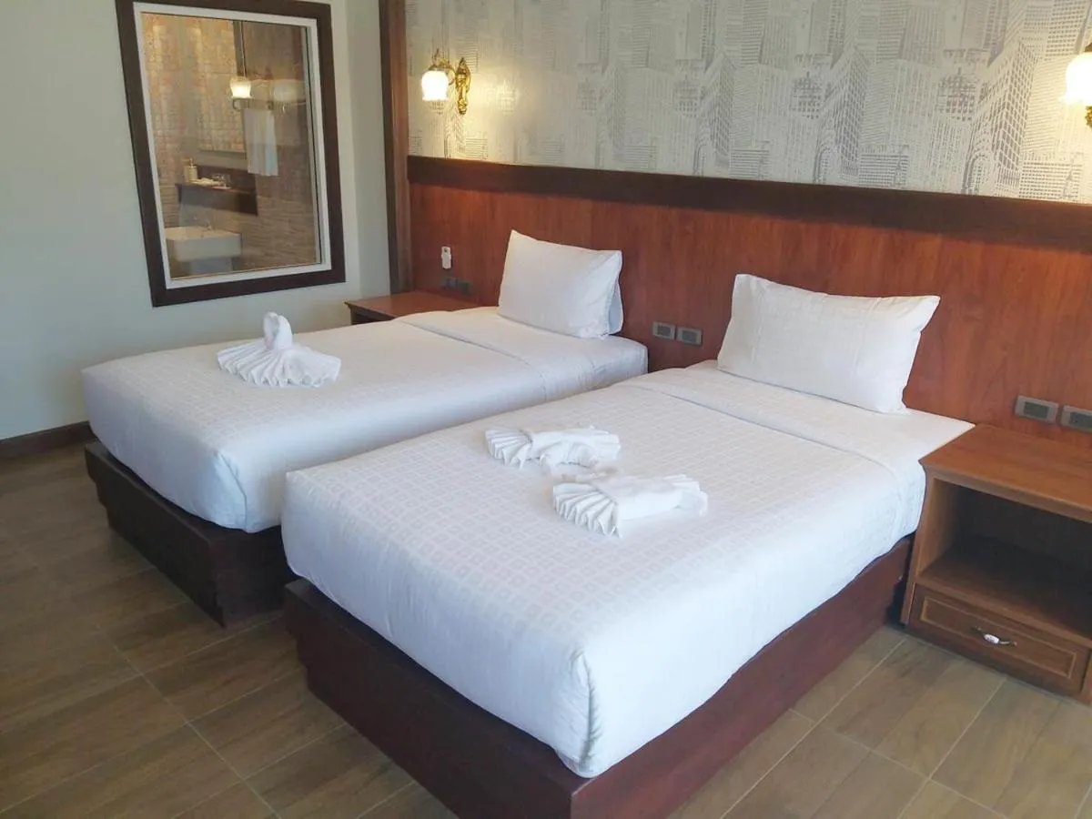 Bed in Le Erawan Phang Nga Hotel