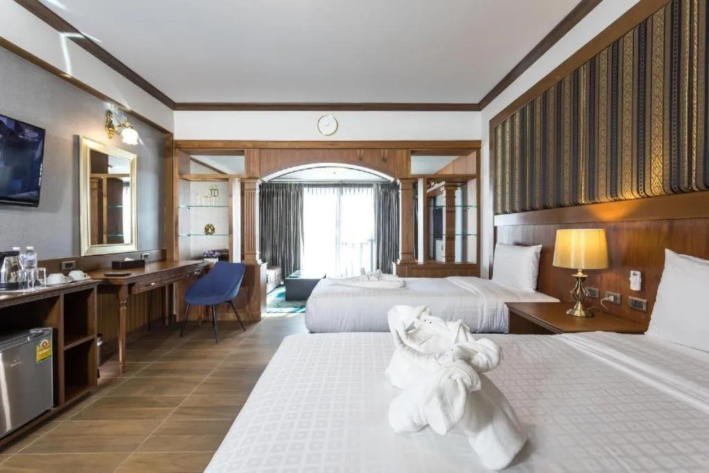 Bed in Le Erawan Phang Nga Hotel