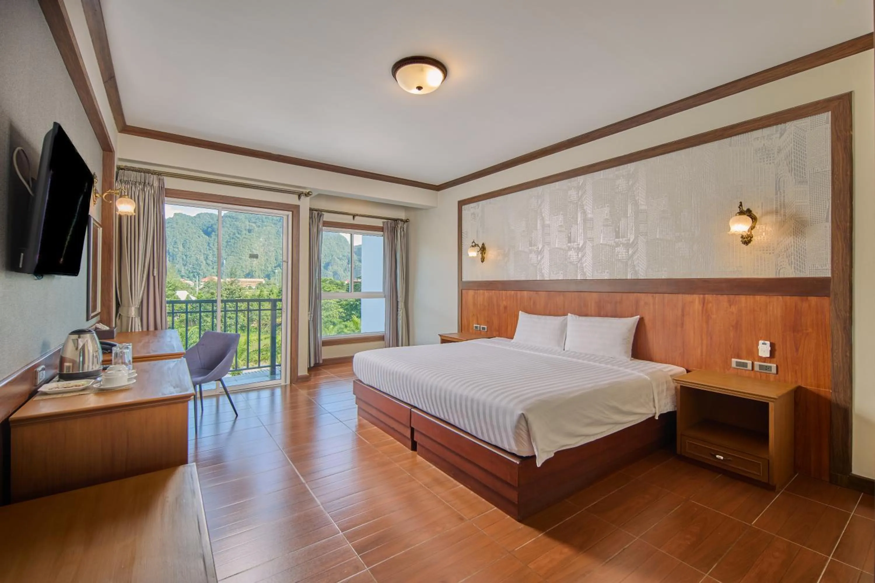 Bed in Le Erawan Phang Nga Hotel