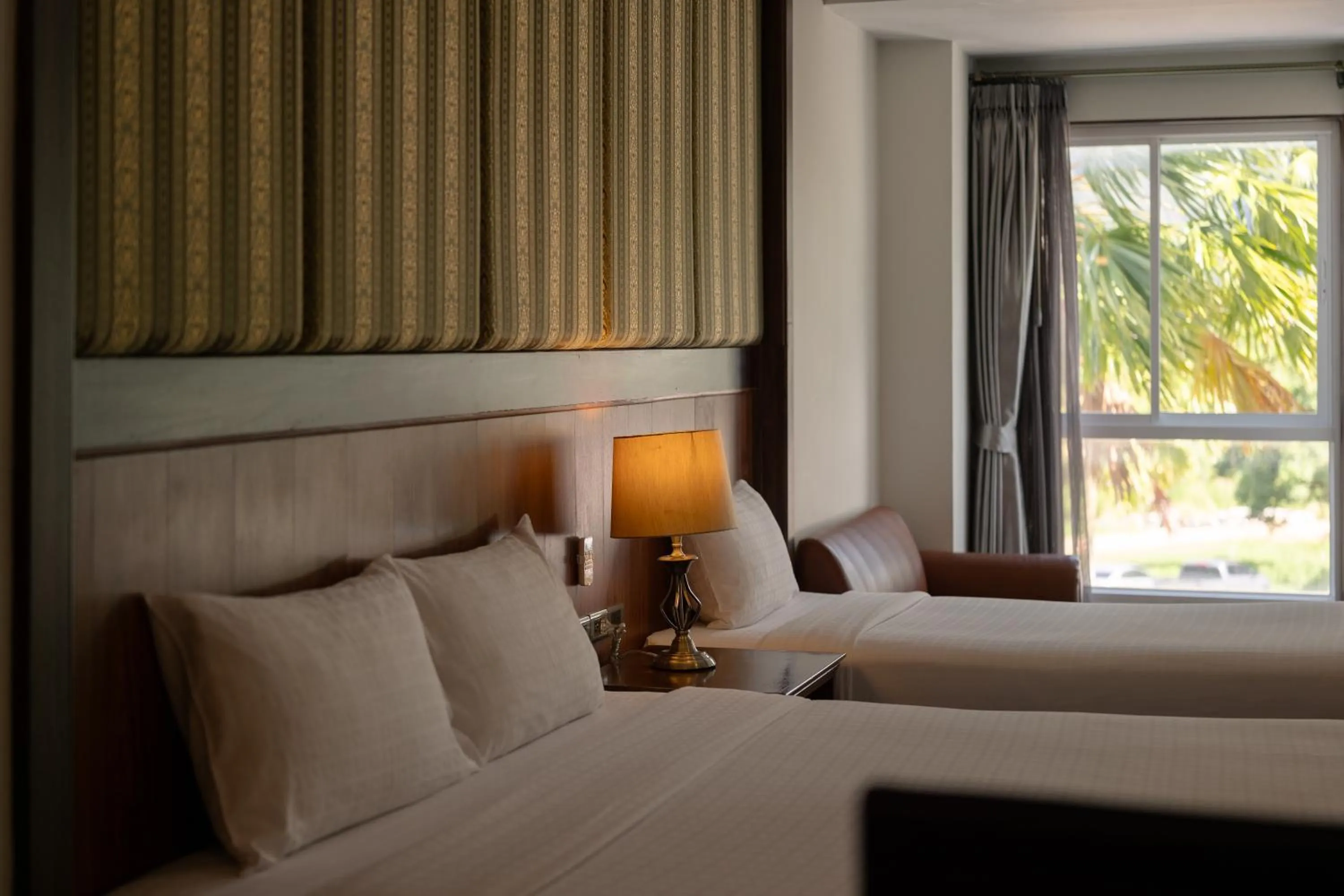 Bed in Le Erawan Phang Nga Hotel