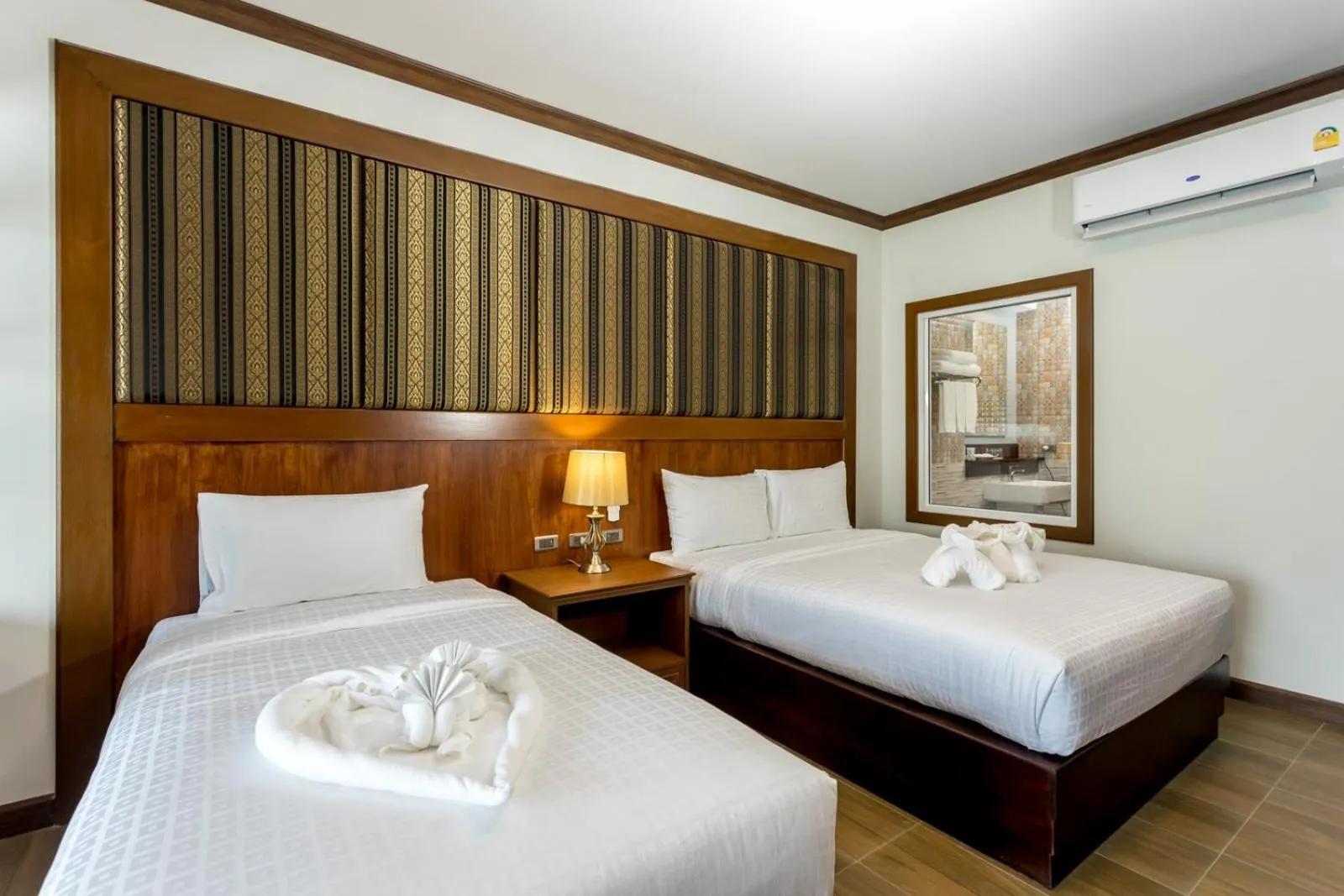 Bed in Le Erawan Phang Nga Hotel