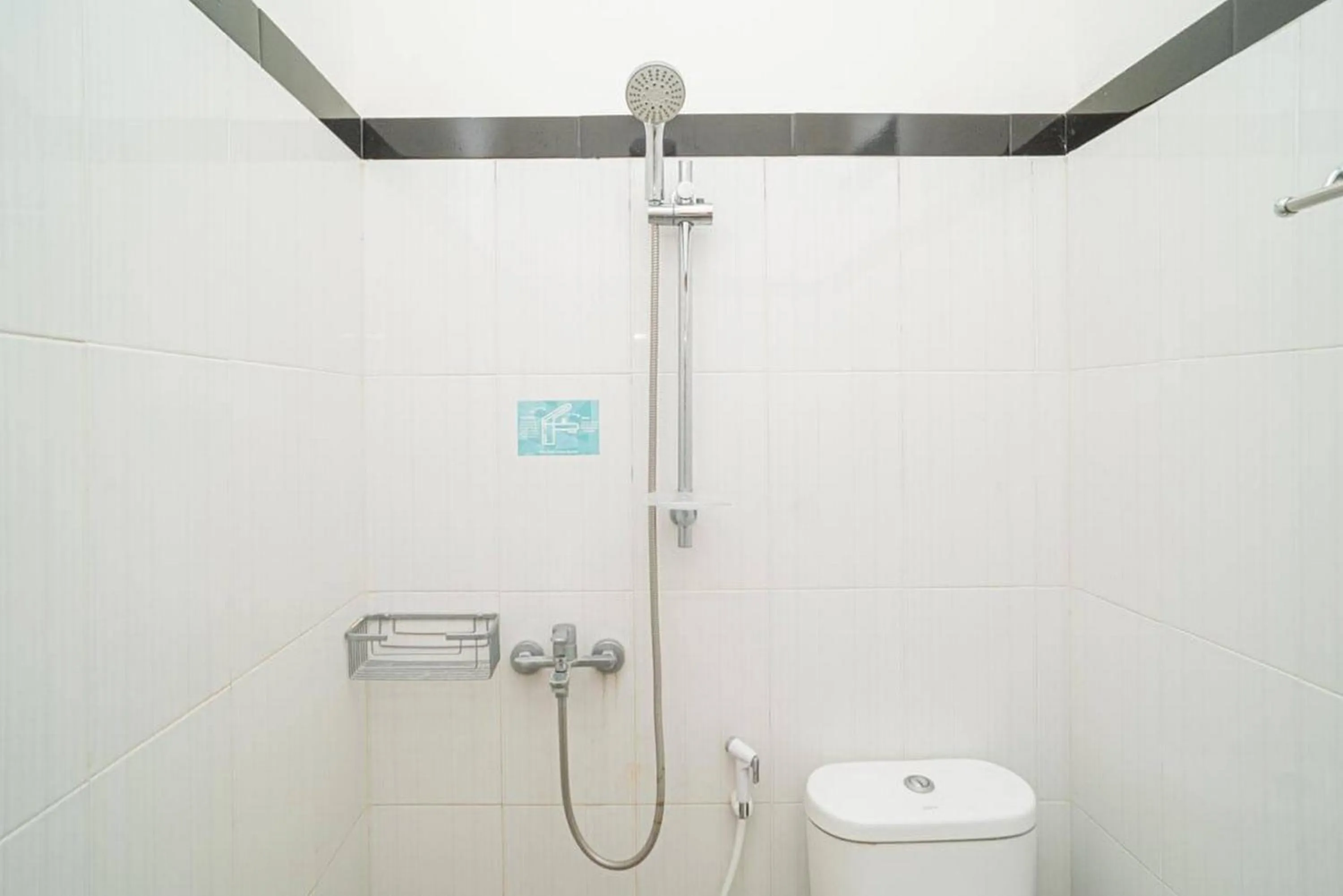 Bathroom in RedDoorz Syariah At Mitra Guest House