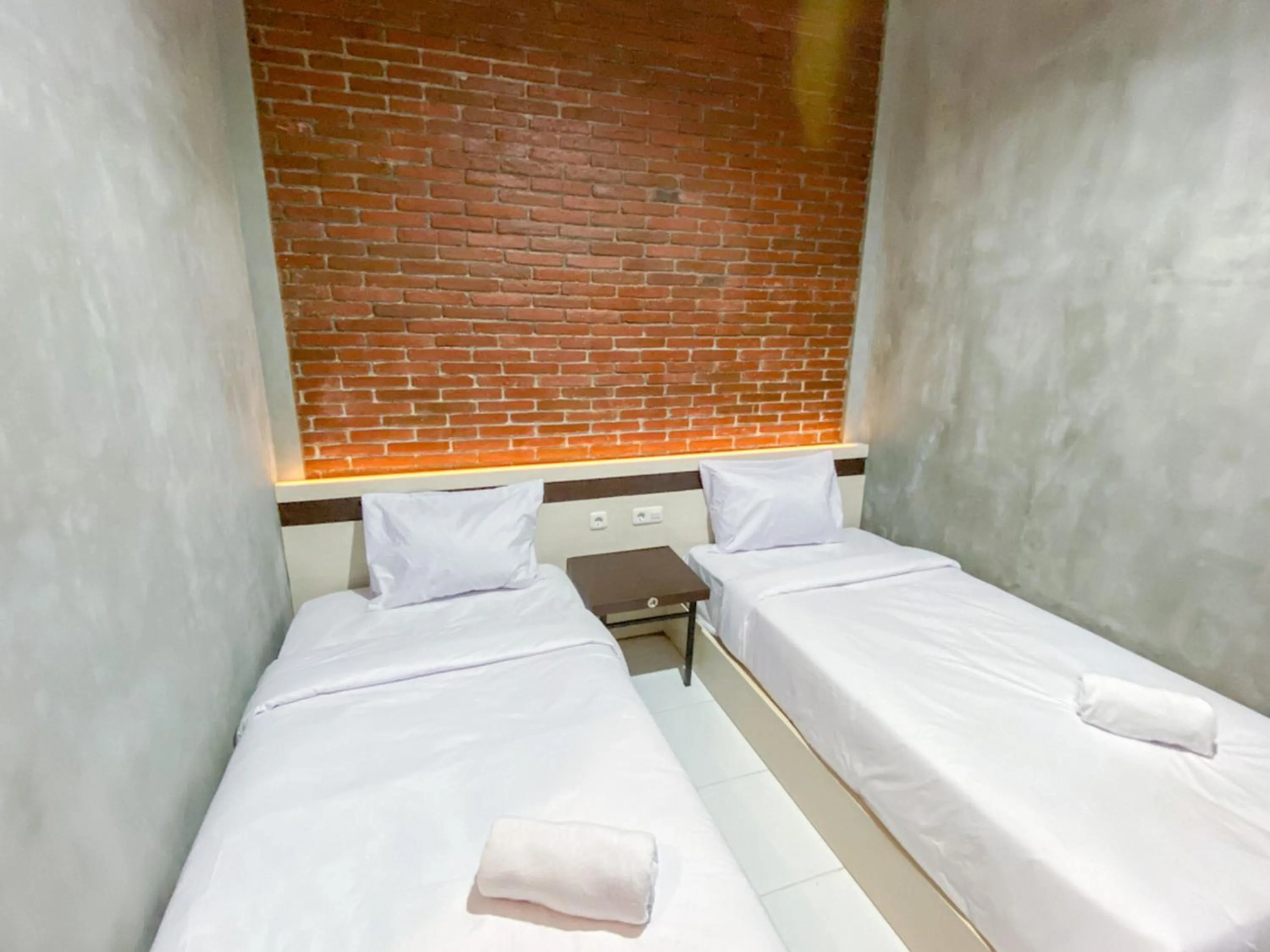 Bed in RedDoorz Syariah At Mitra Guest House