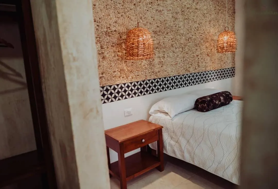 Bed in Hotel Boutique Bugambilias