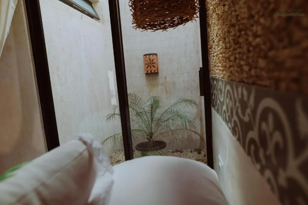 Bed in Hotel Boutique Bugambilias