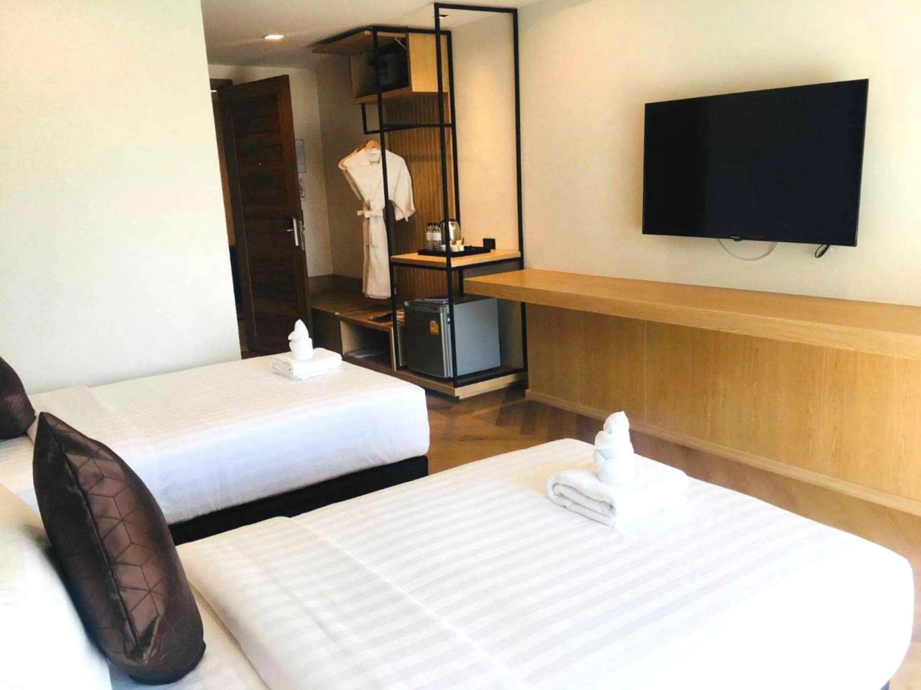 Communal lounge/ TV room, Bed in Sann Boutique Hotel