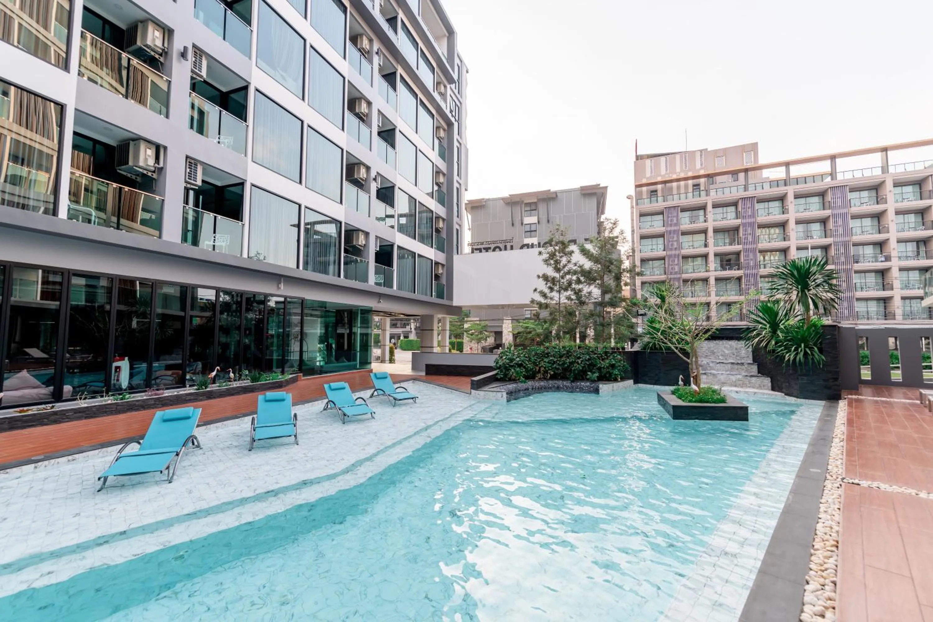 Swimming pool in The Proud Hotel Pattaya - SHA Certified