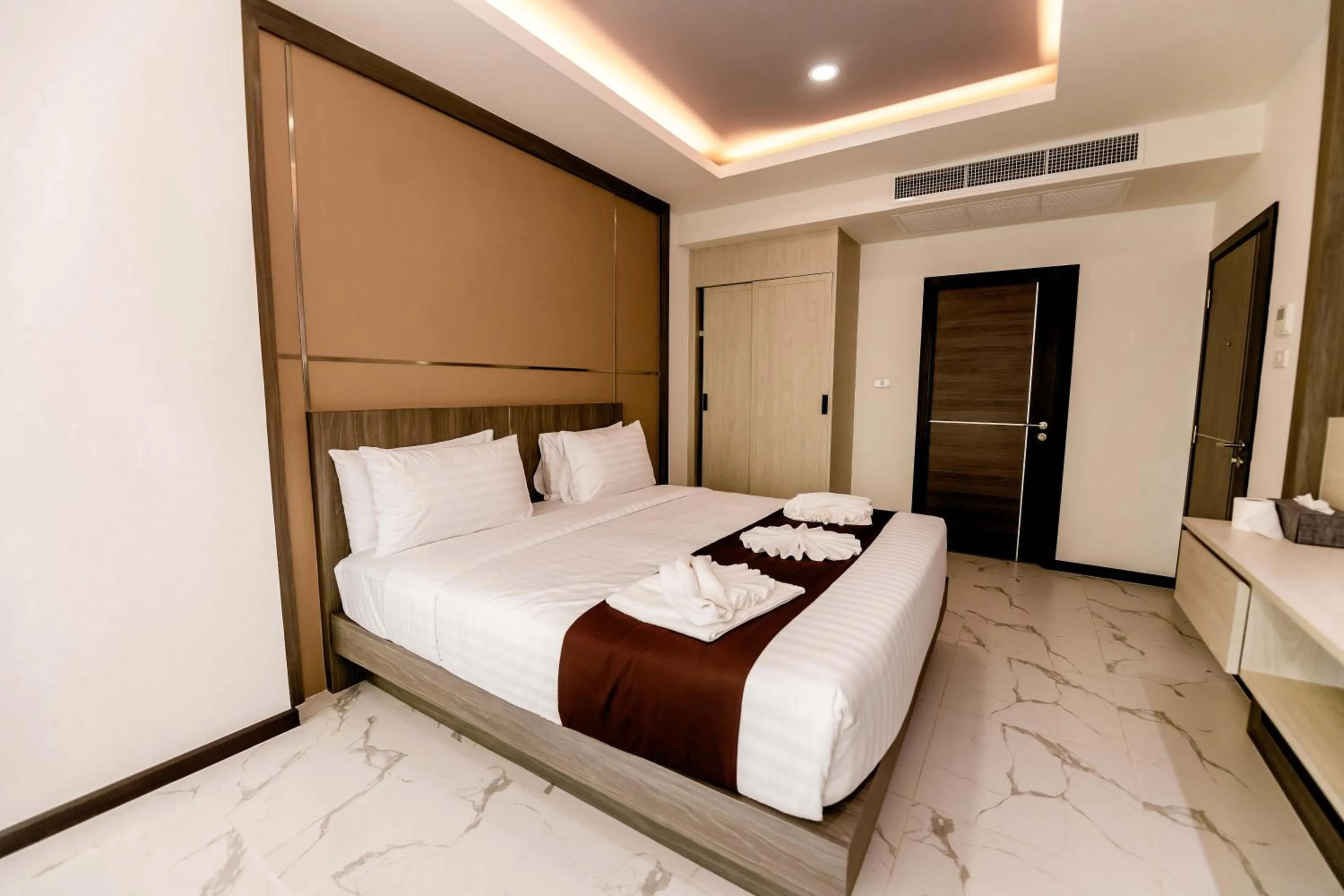 Bed in The Proud Hotel Pattaya - SHA Certified