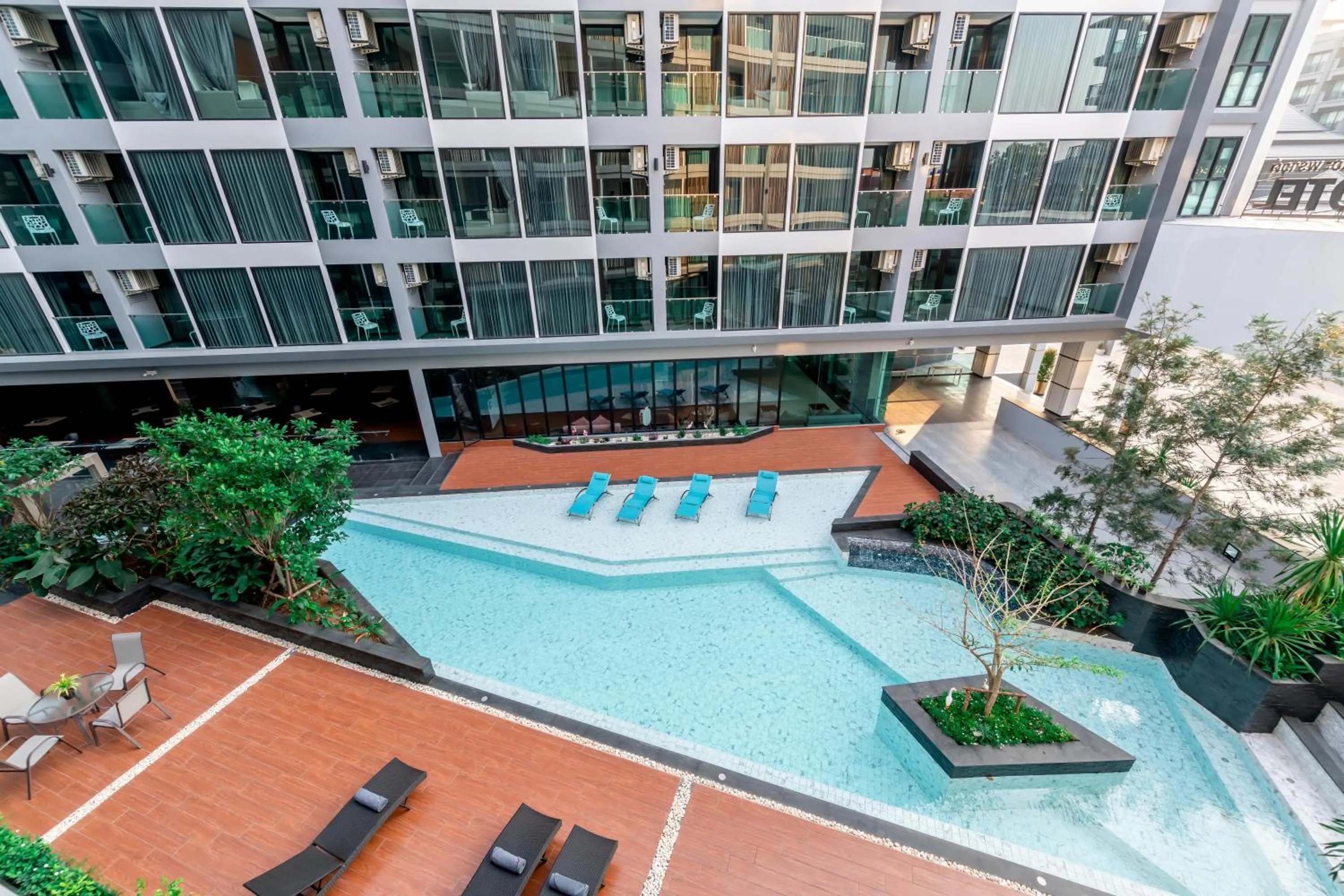 Swimming pool in The Proud Hotel Pattaya - SHA Certified