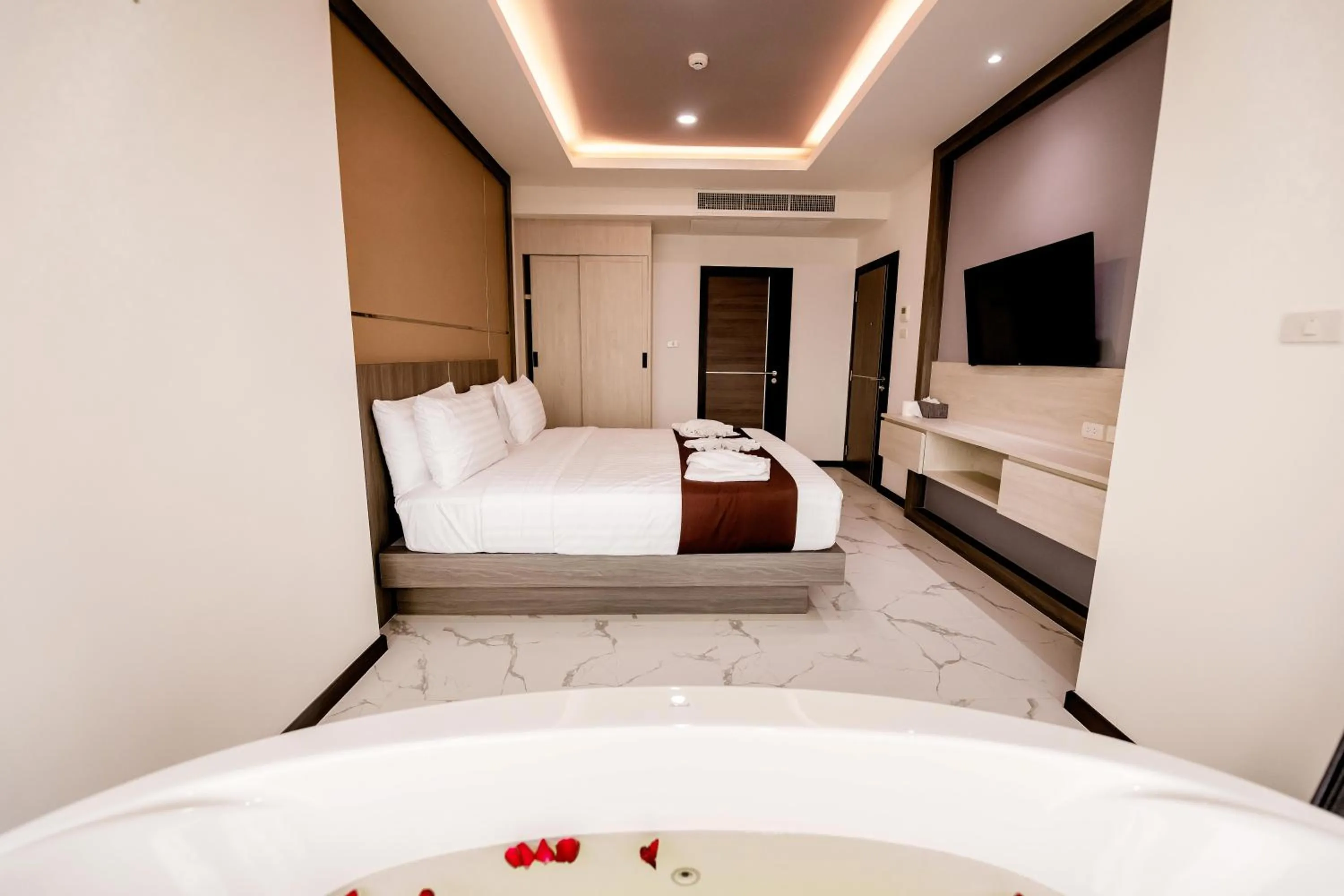 Bed in The Proud Hotel Pattaya - SHA Certified