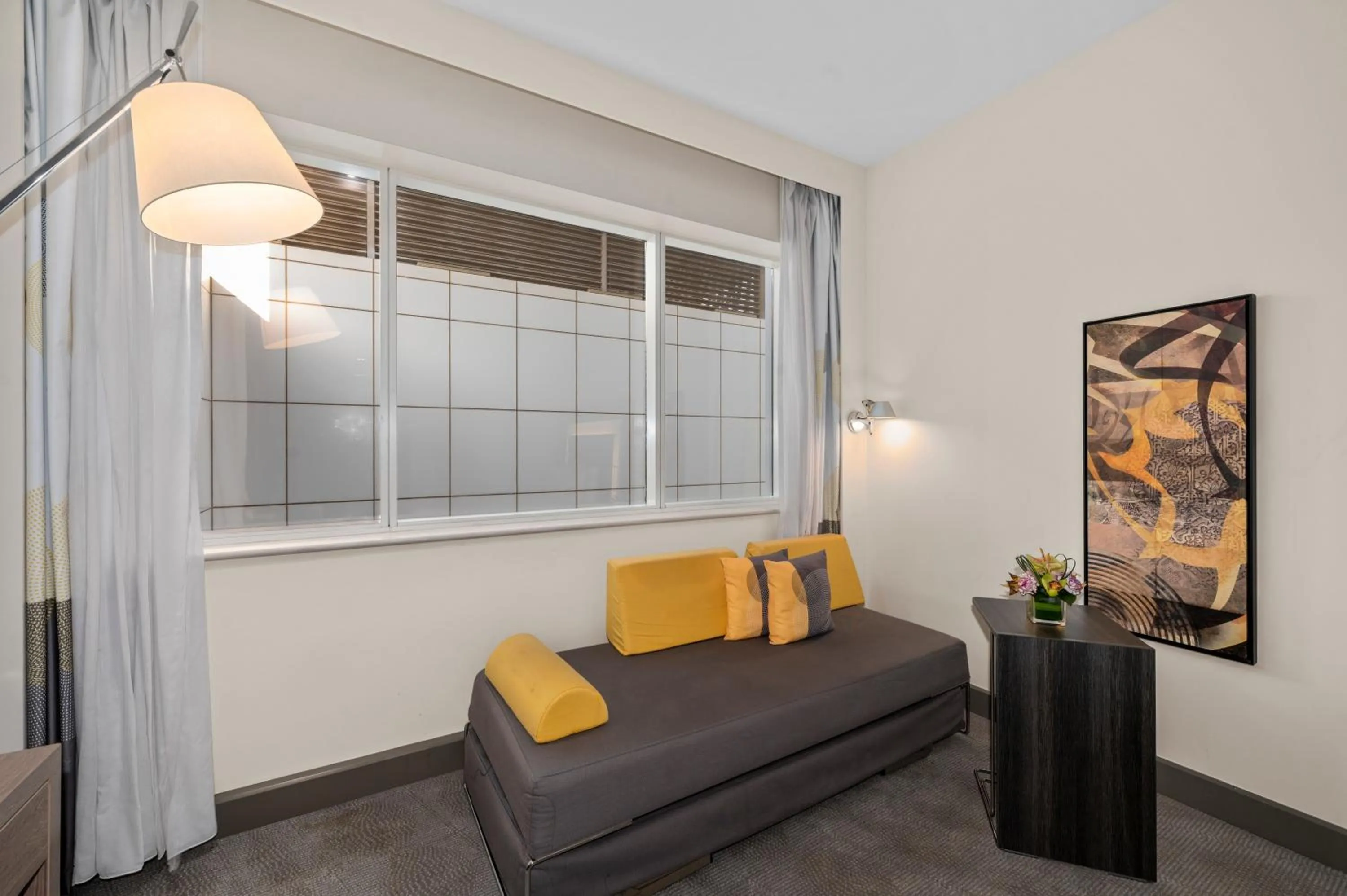 Seating area, Bed in Novotel Dubai World Trade Centre