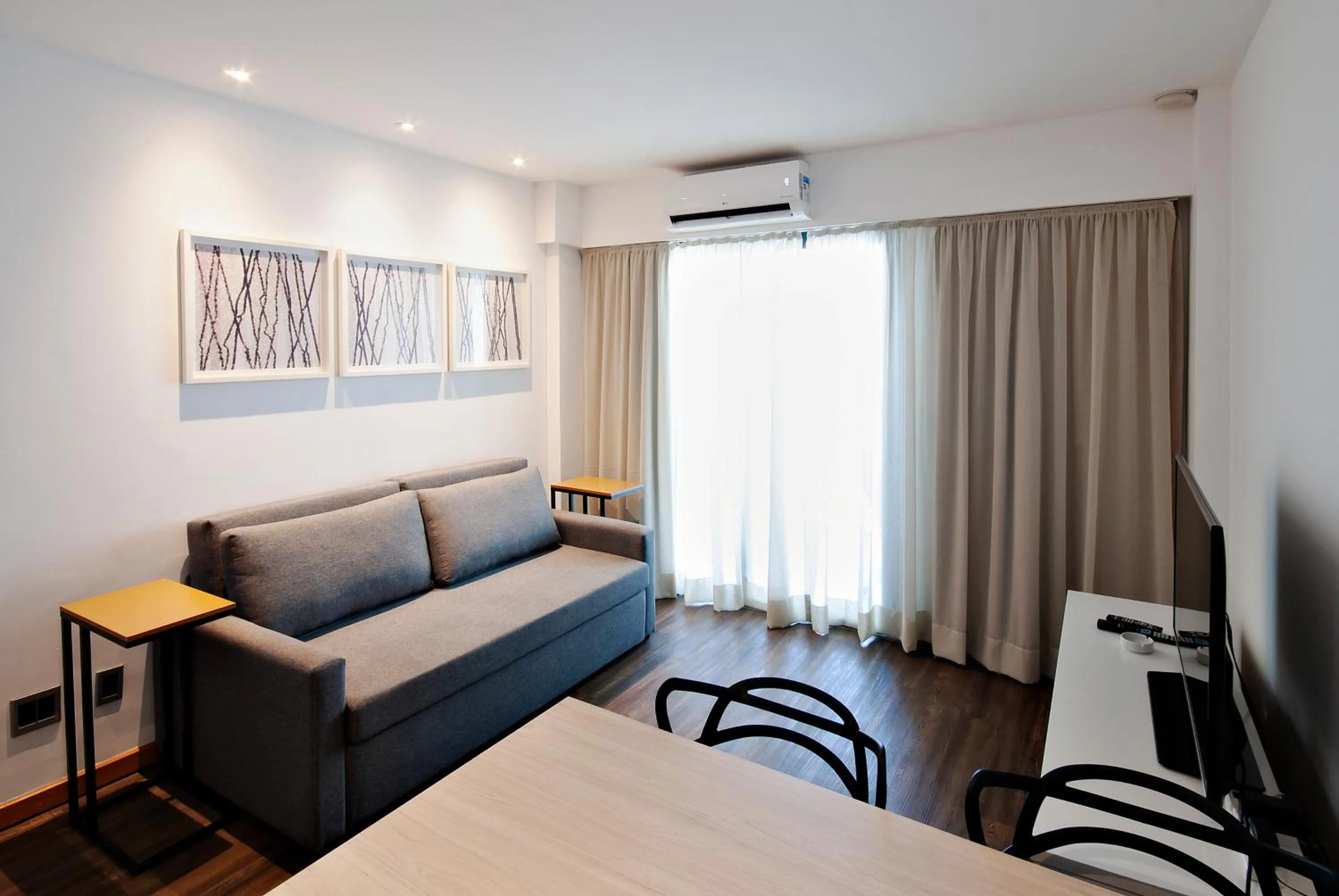 Living room, Bed in Anna Suites Ipanema by Arena Hotéis