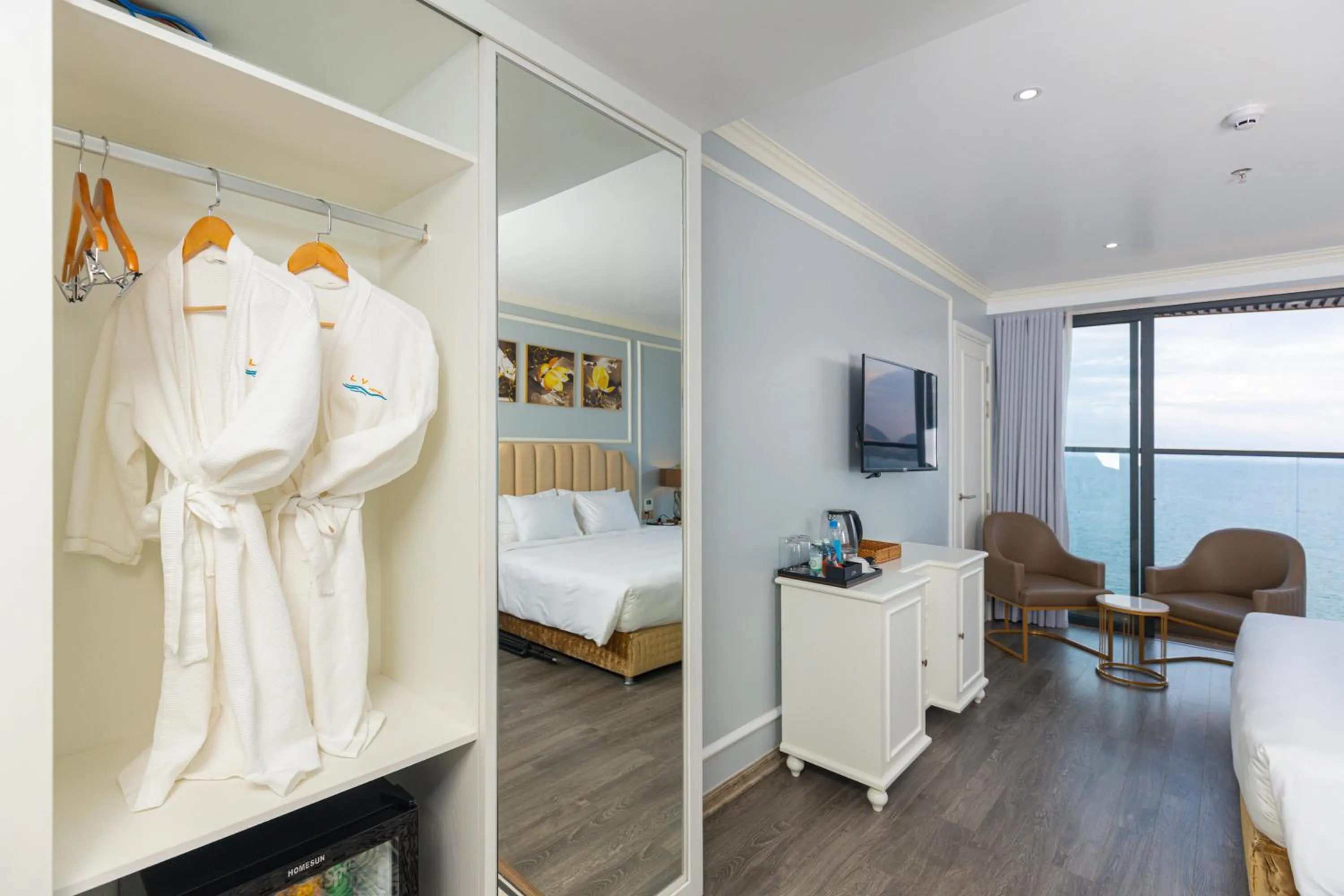 Seating area, Bed in La Vague Hotel