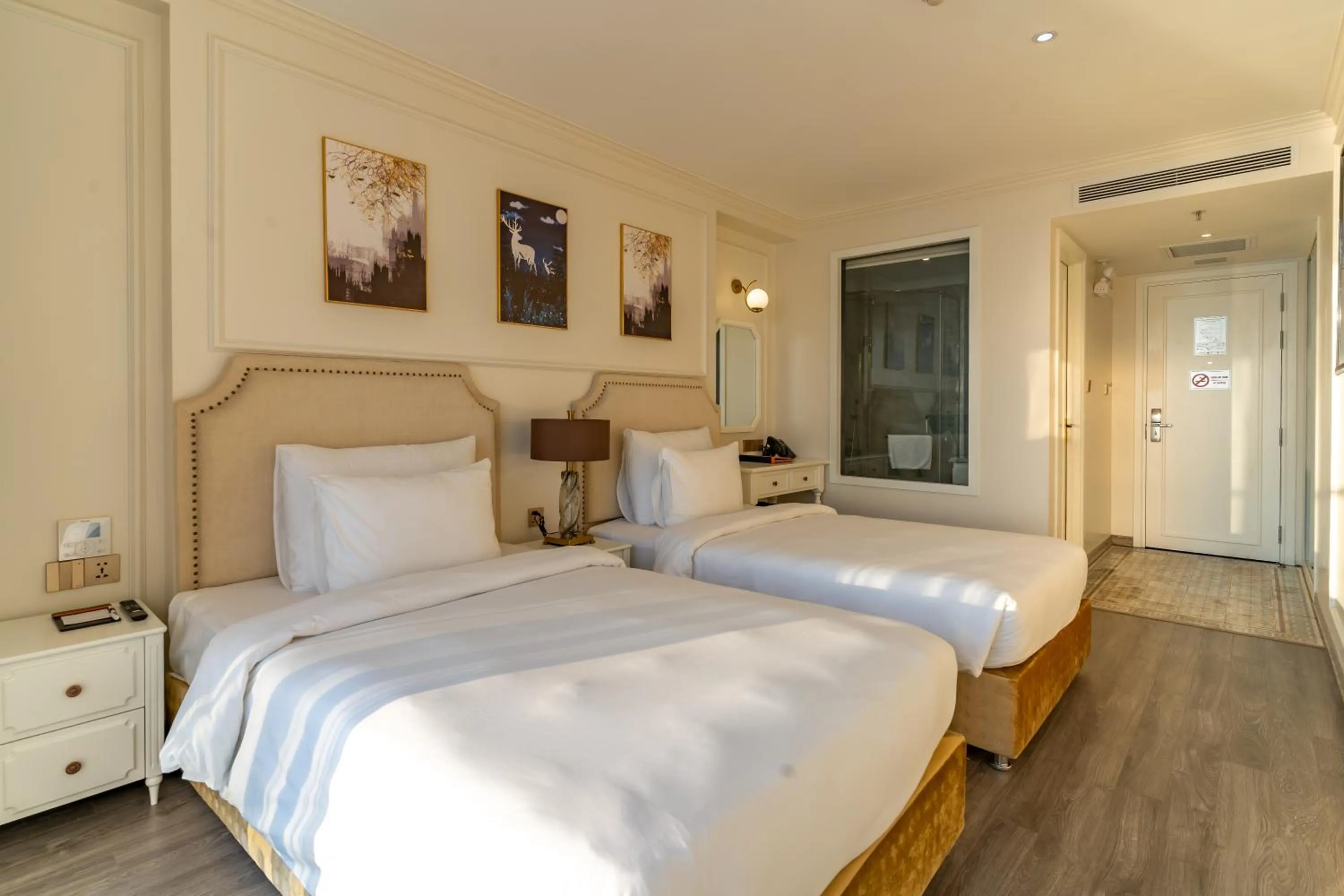 Bed in La Vague Hotel