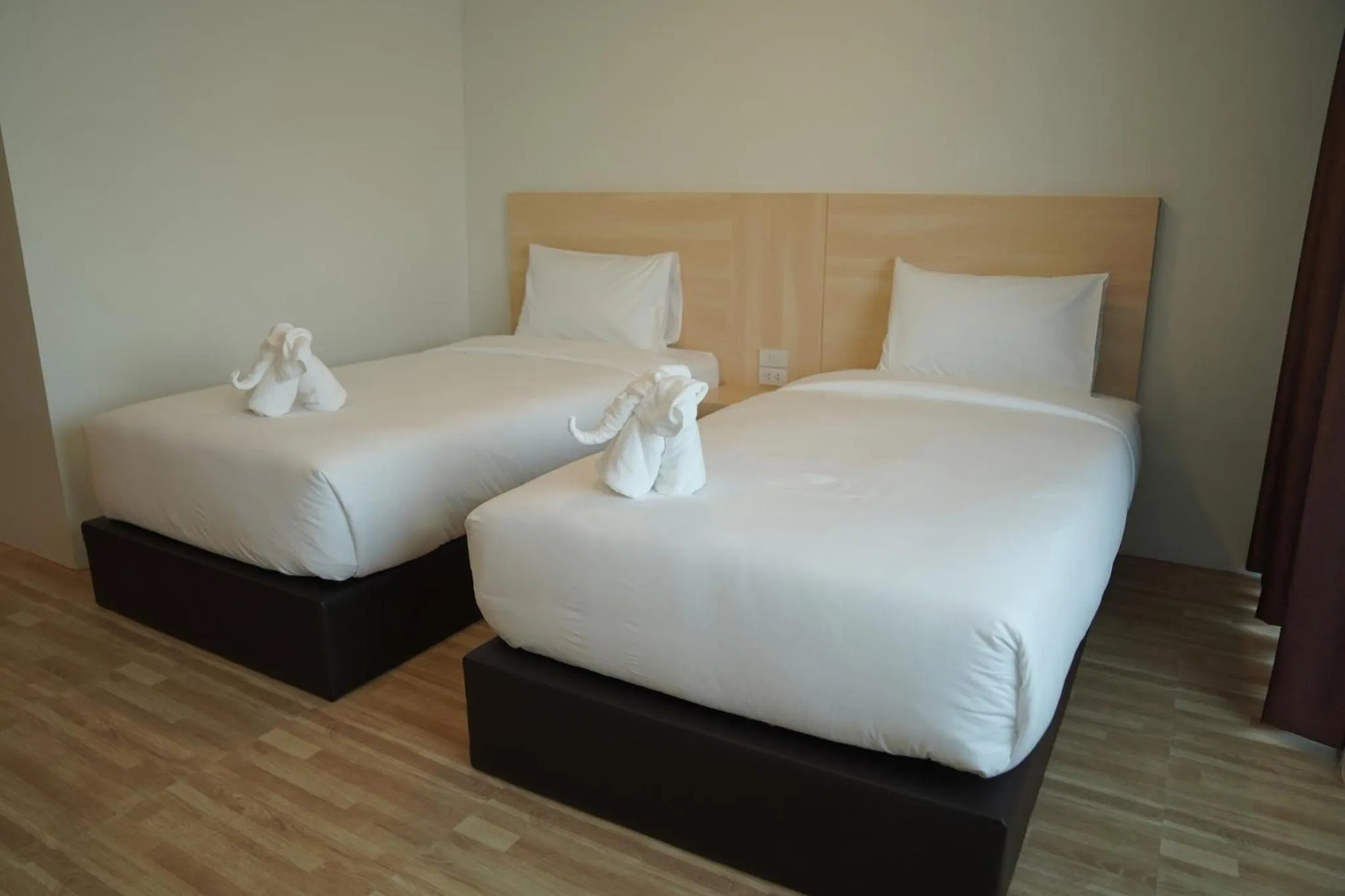 Bed in The charlotte smart hotel lopburi