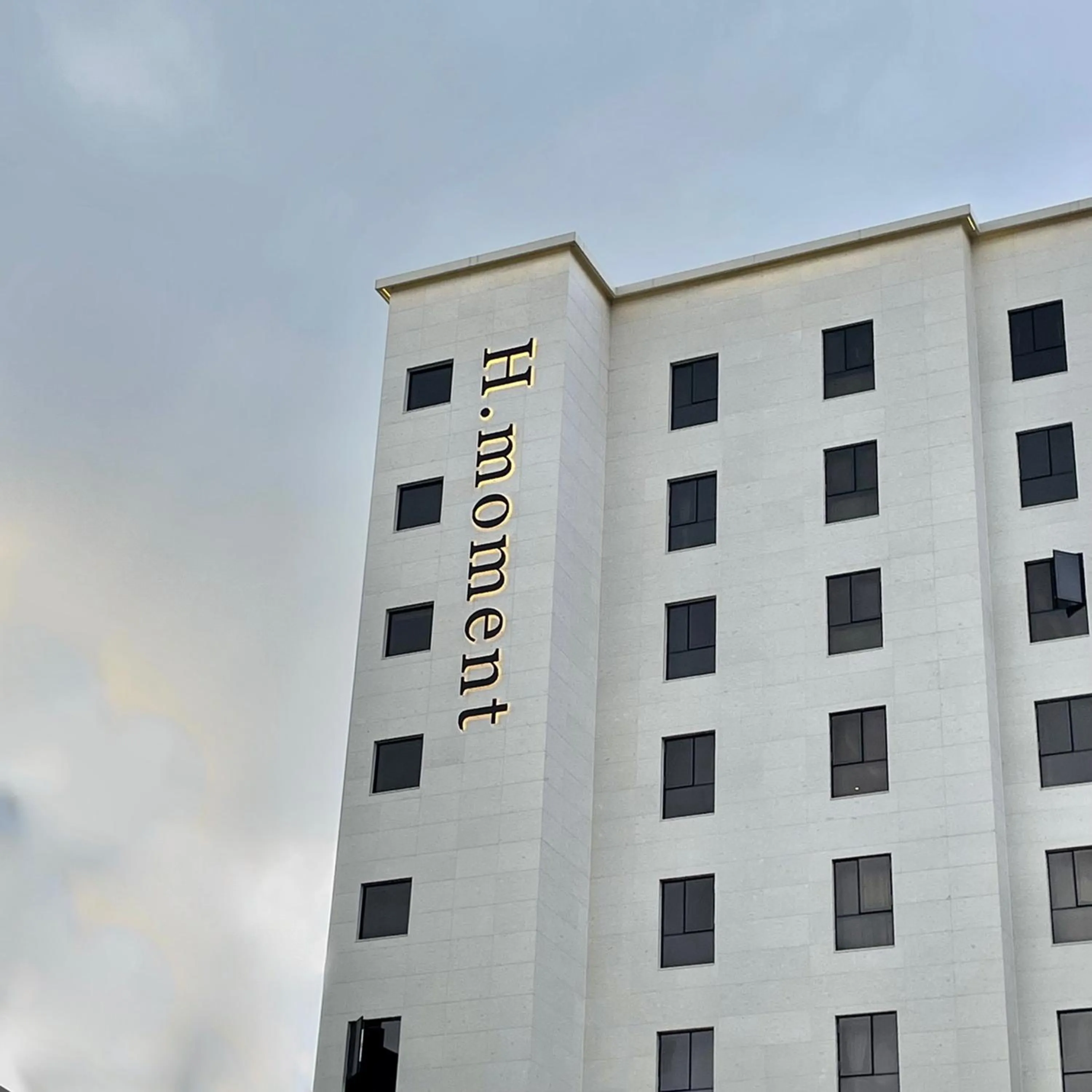 Property logo or sign in H moment Hotel songjeong