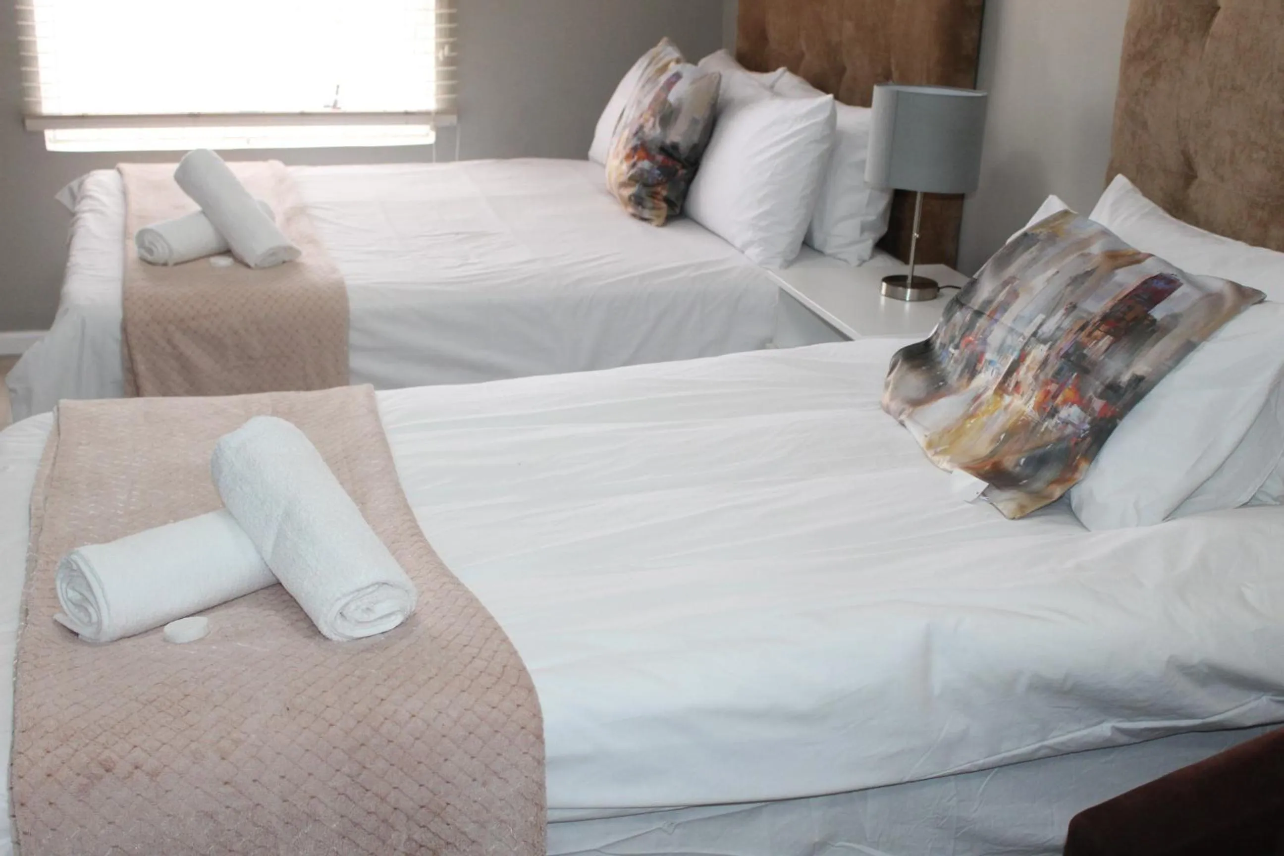 Bed in 103onWallace Self Catering Guest House