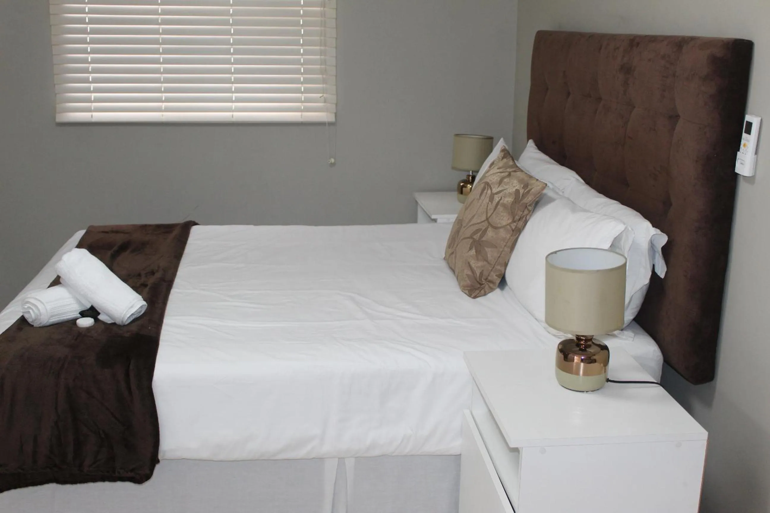 Bed in 103onWallace Self Catering Guest House