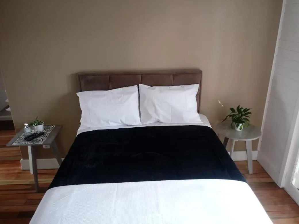 Bed in Pousada Toscana Cambará