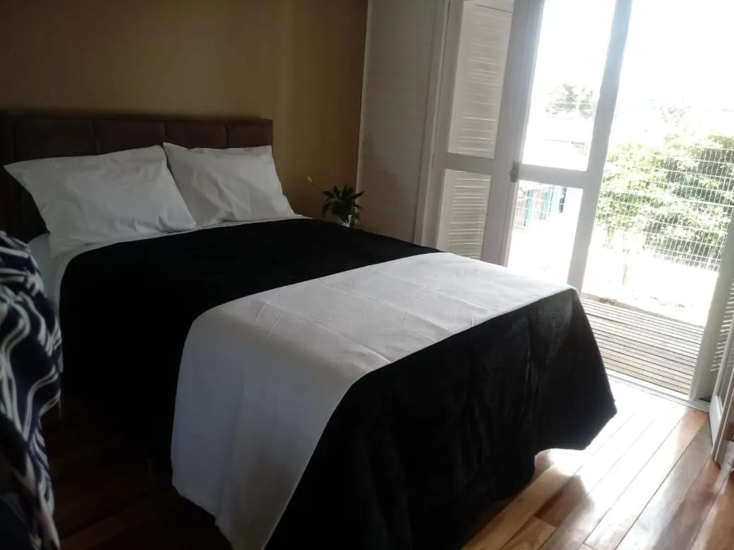 Bed in Pousada Toscana Cambará