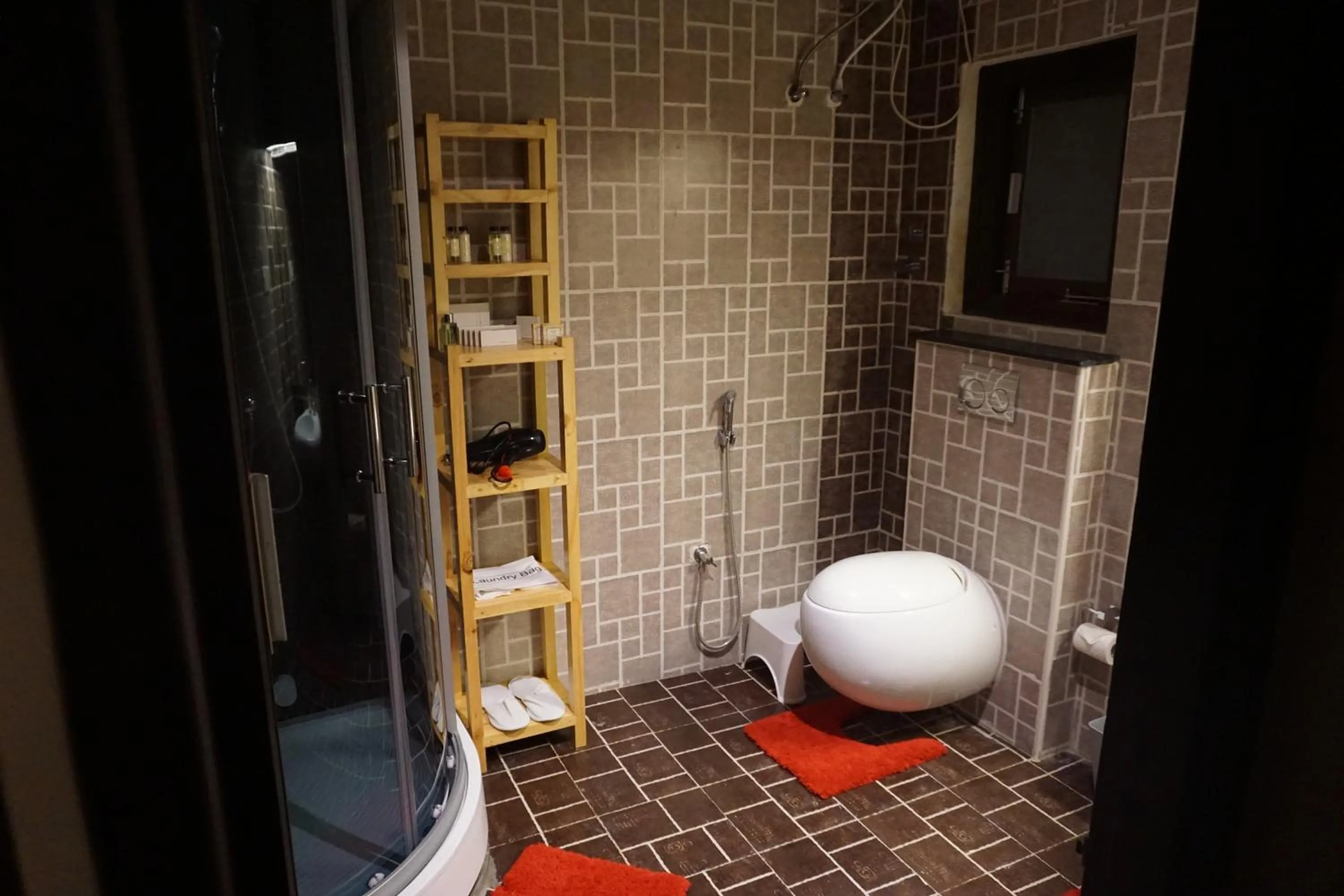 Bathroom in COTTAGES BY THE CREEK.